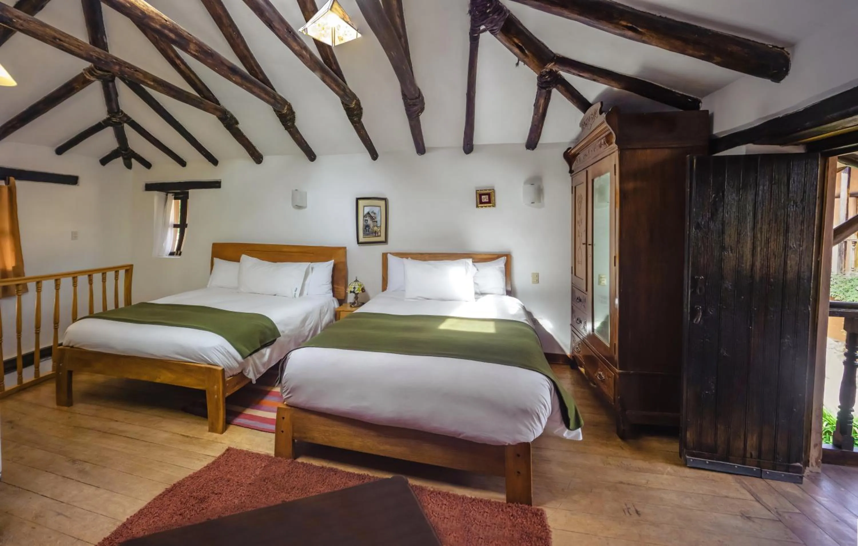 Photo of the whole room, Bed in Lizzy Wasi Urubamba