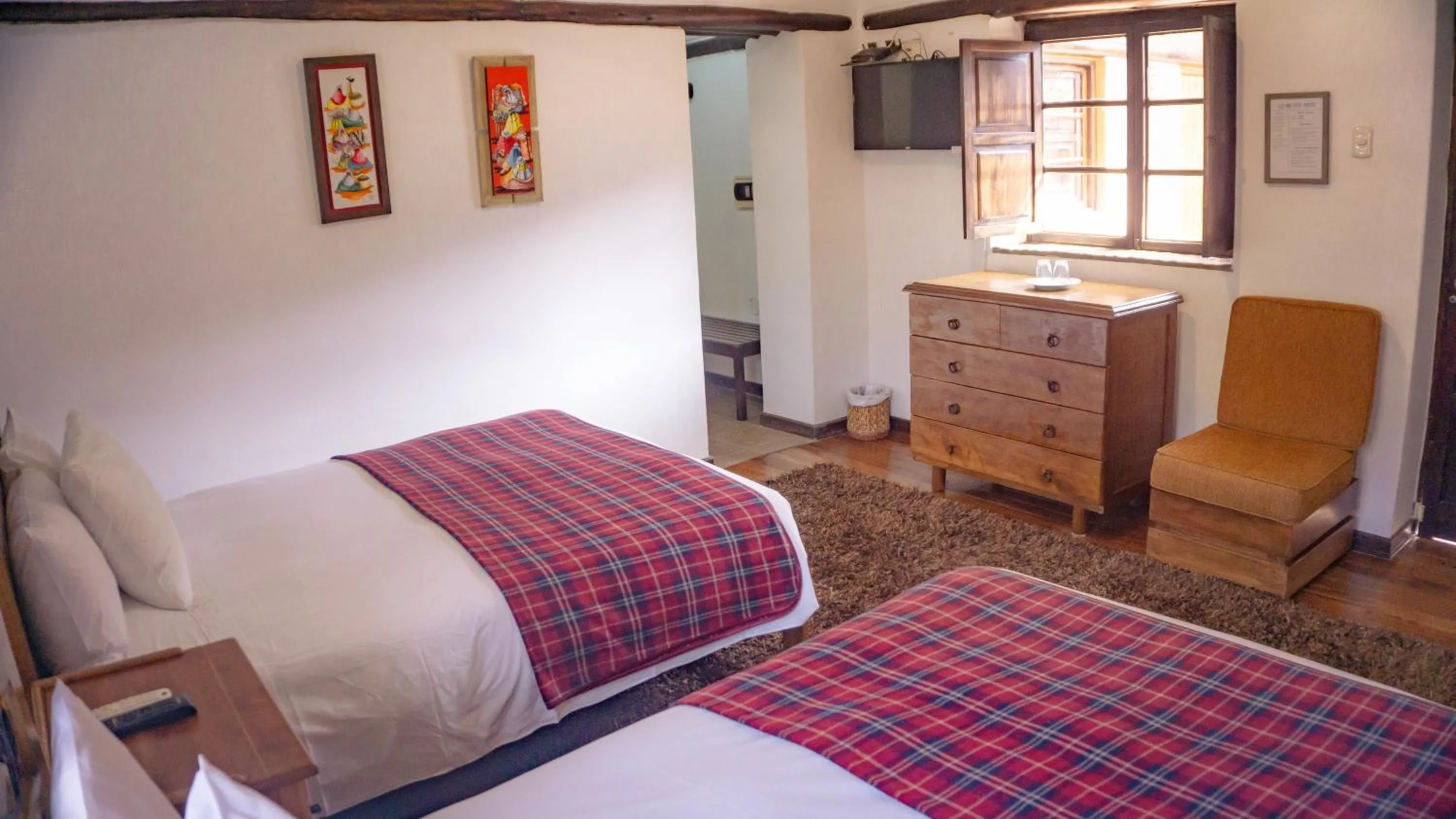 Photo of the whole room, Bed in Lizzy Wasi Urubamba