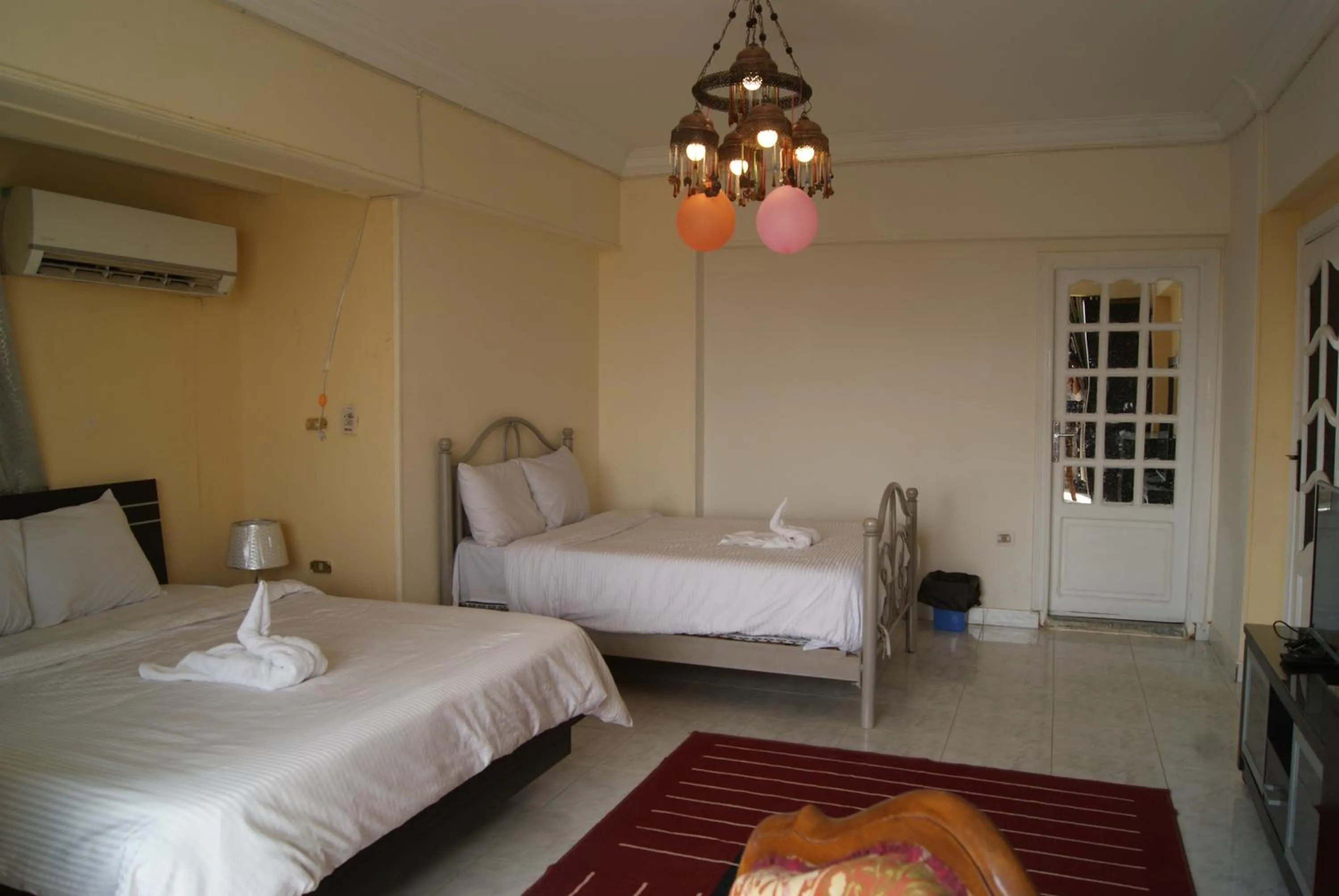 Photo of the whole room, Bed in Triangle Pyramids Boutique