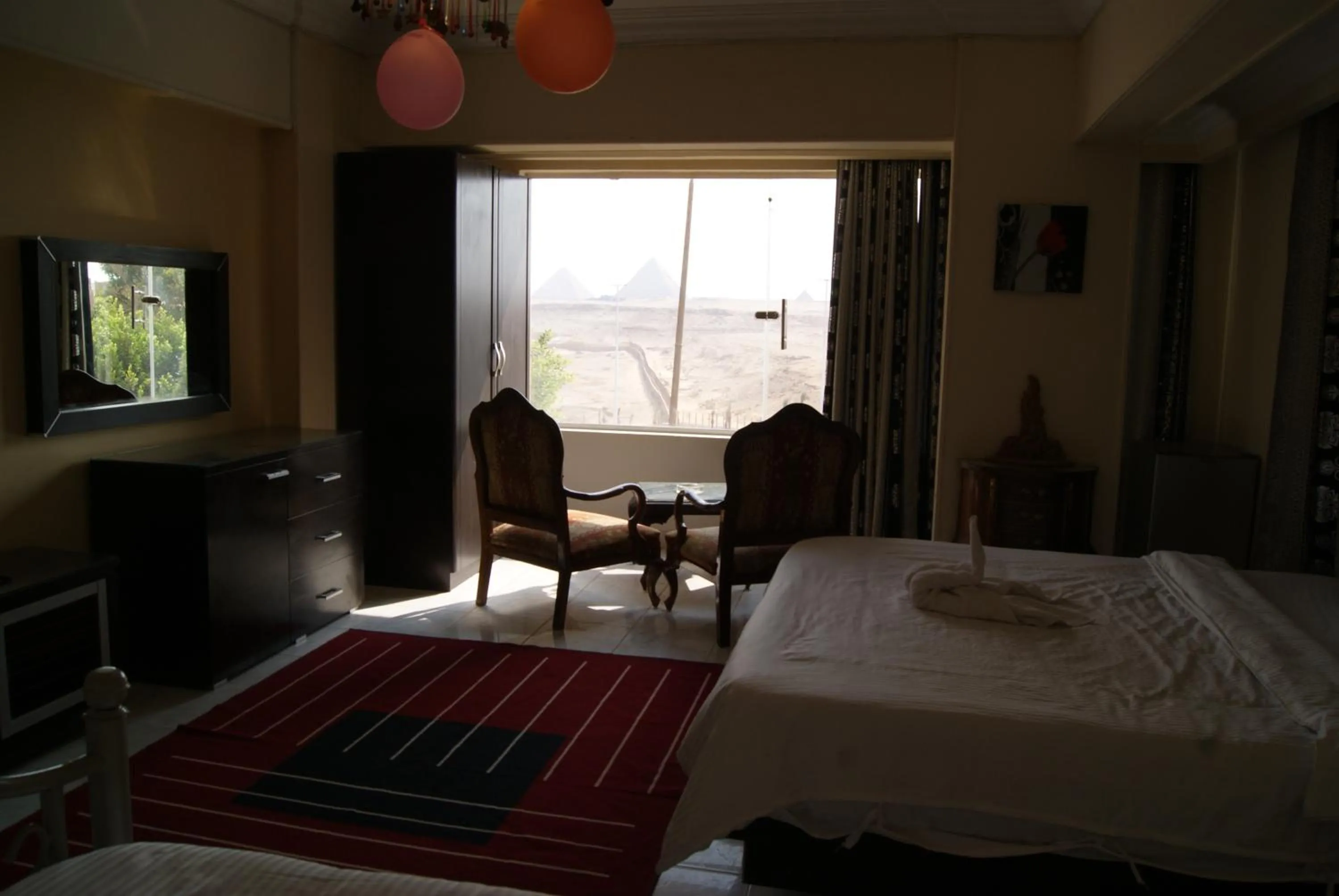 Photo of the whole room, Bed in Triangle Pyramids Boutique
