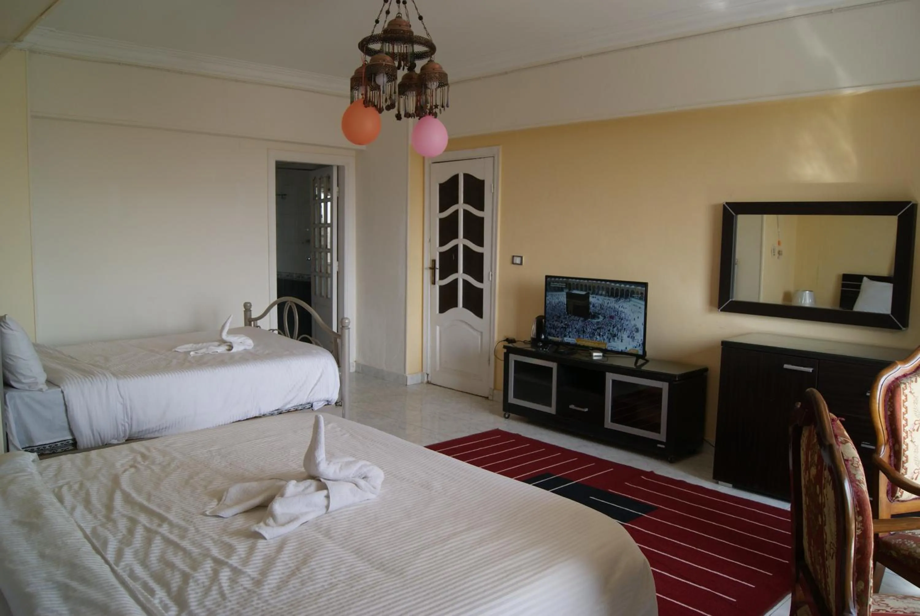 Photo of the whole room, Bed in Triangle Pyramids Boutique