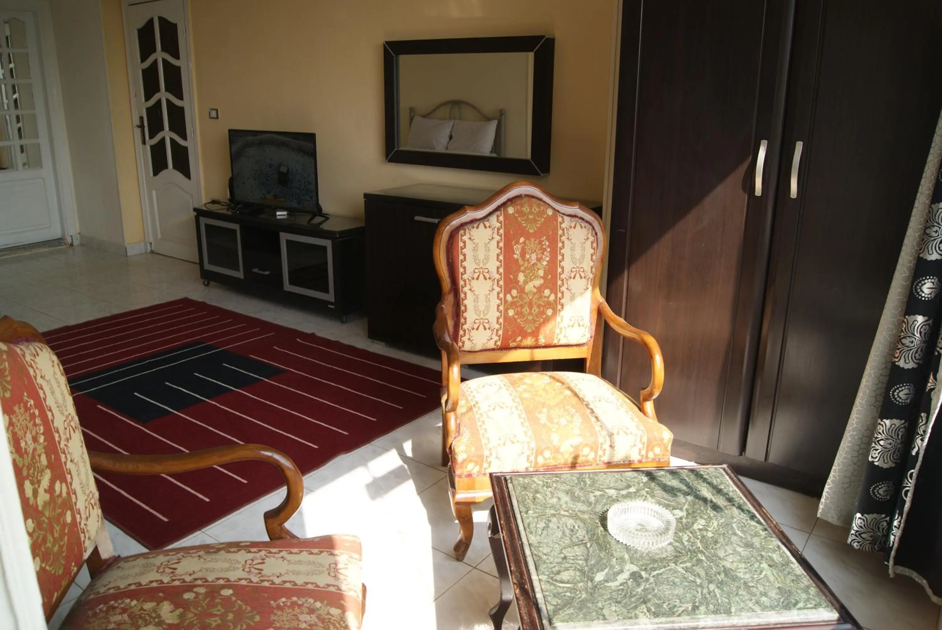 Photo of the whole room, Bed in Triangle Pyramids Boutique