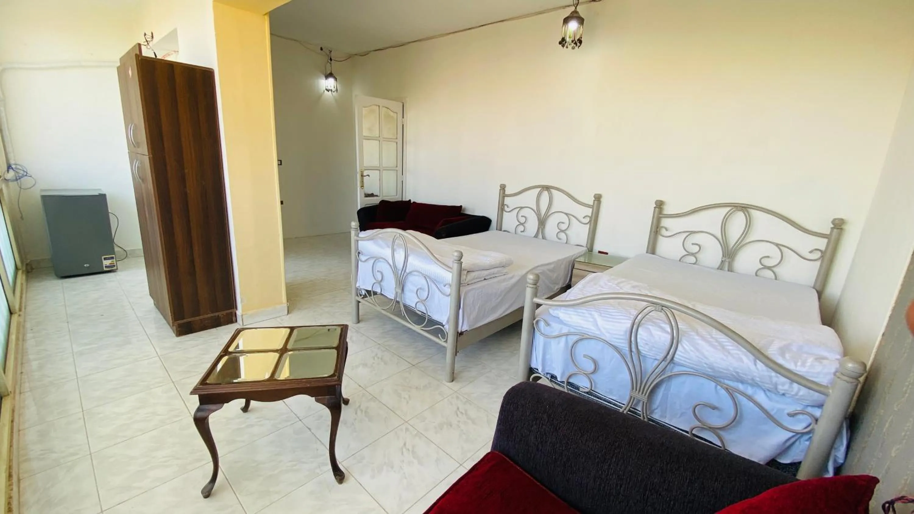 Photo of the whole room, Bed in Triangle Pyramids Boutique