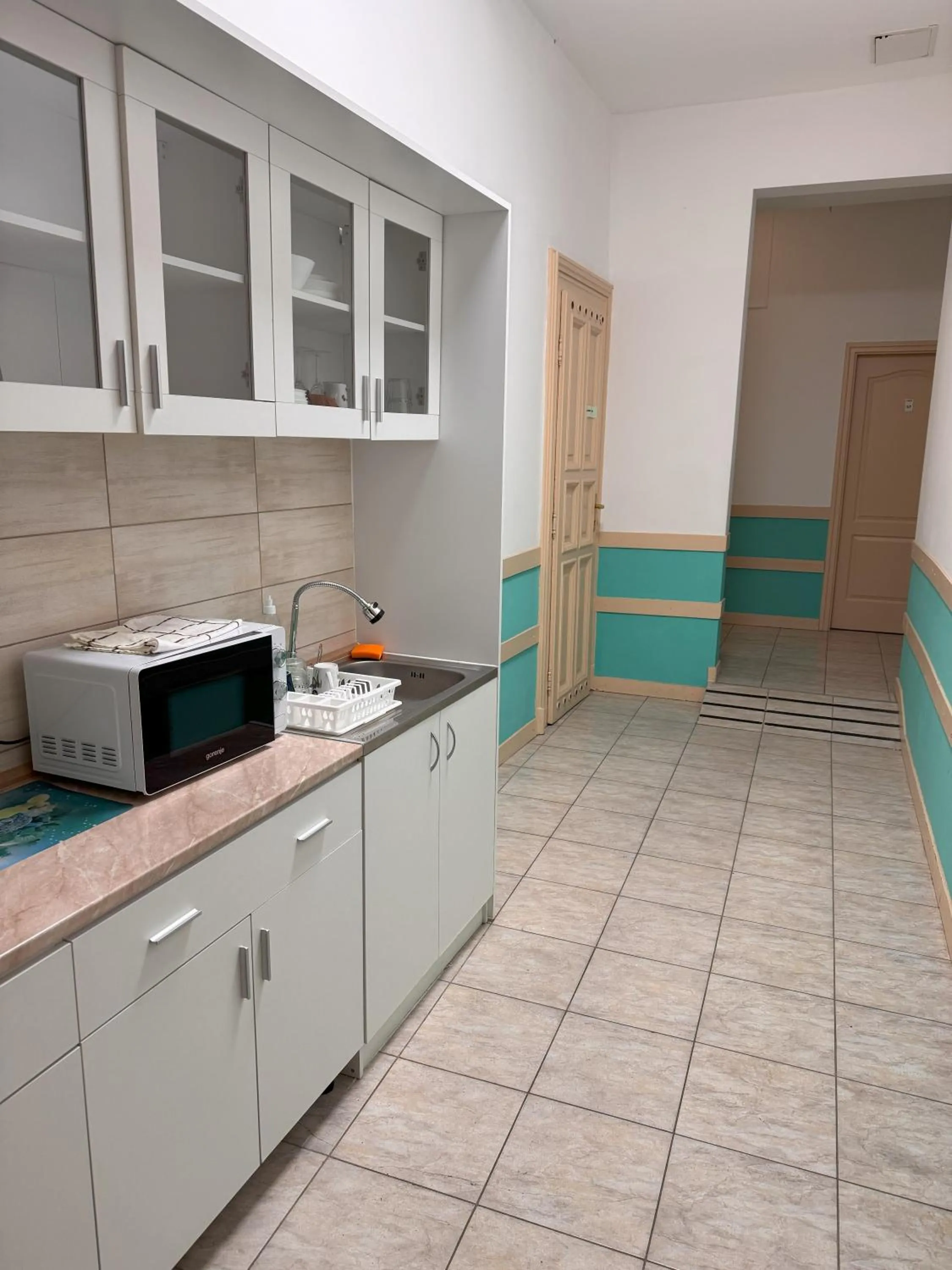 Kitchen or kitchenette in Omega Guesthouse Budapest