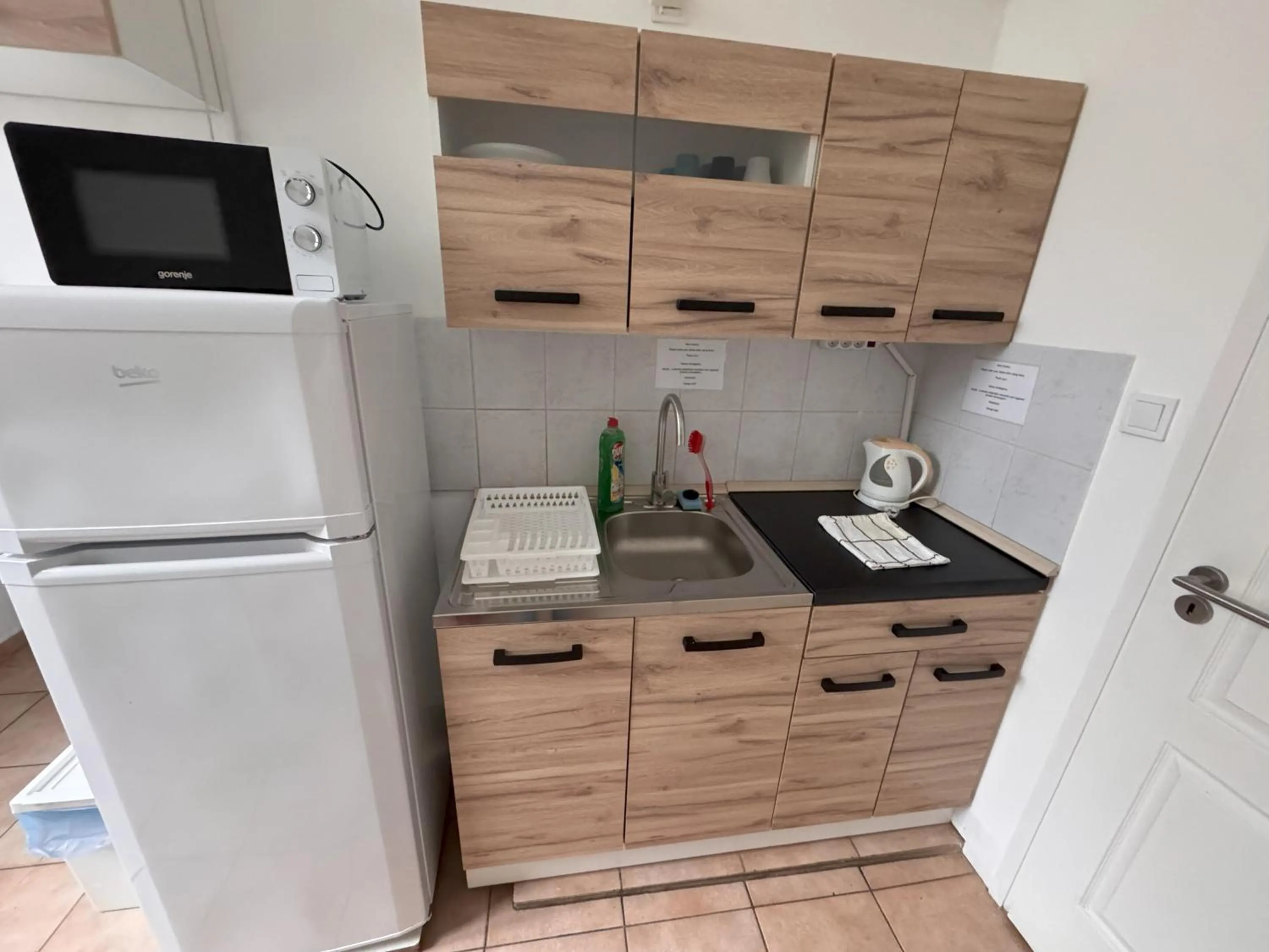 Kitchen or kitchenette in Omega Guesthouse Budapest