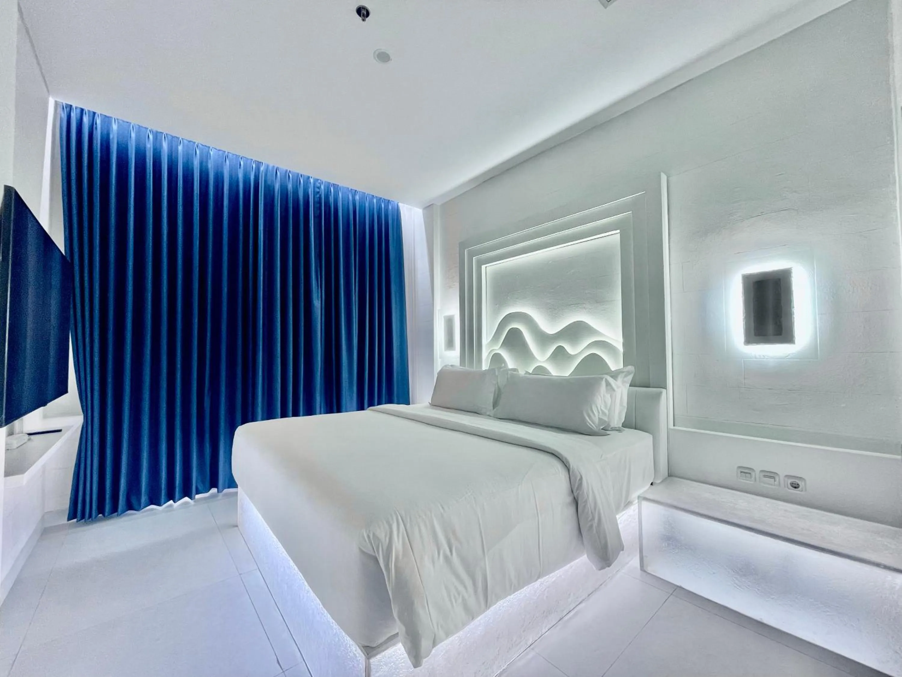 Bed in Hemangini Hotel Bandung