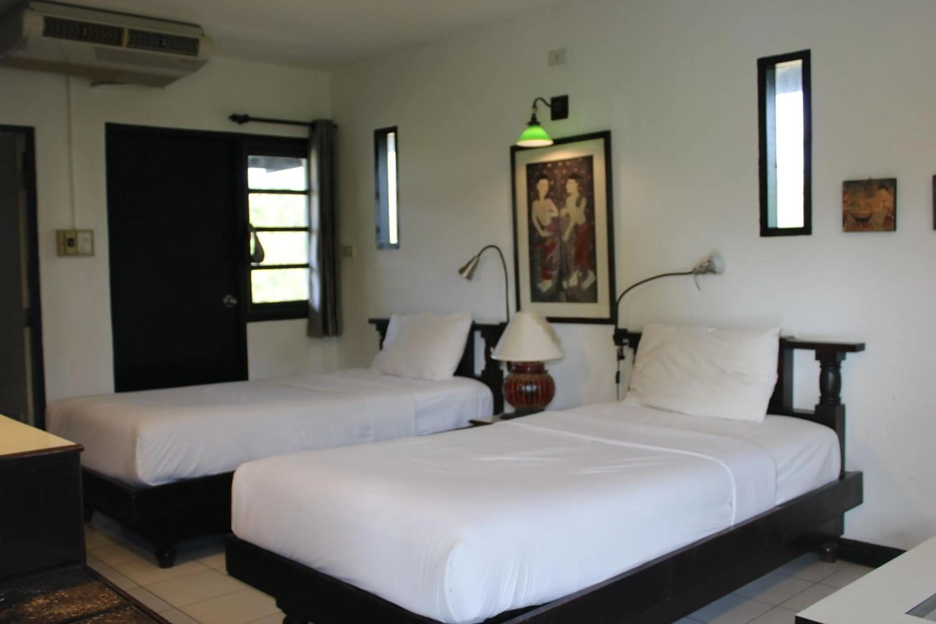 Bed in Baan Orawee Boutique Hotel