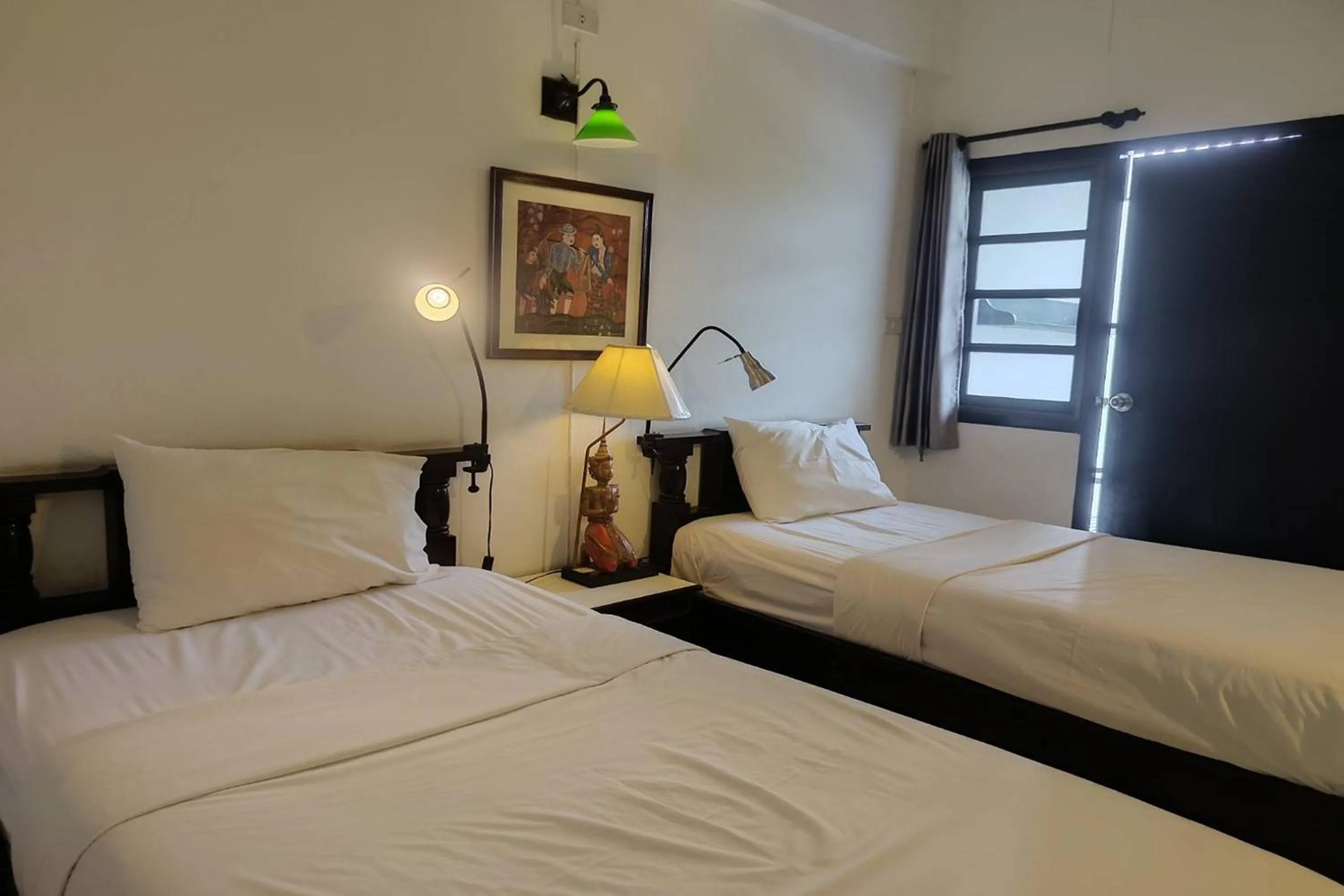 Bed in Baan Orawee Boutique Hotel