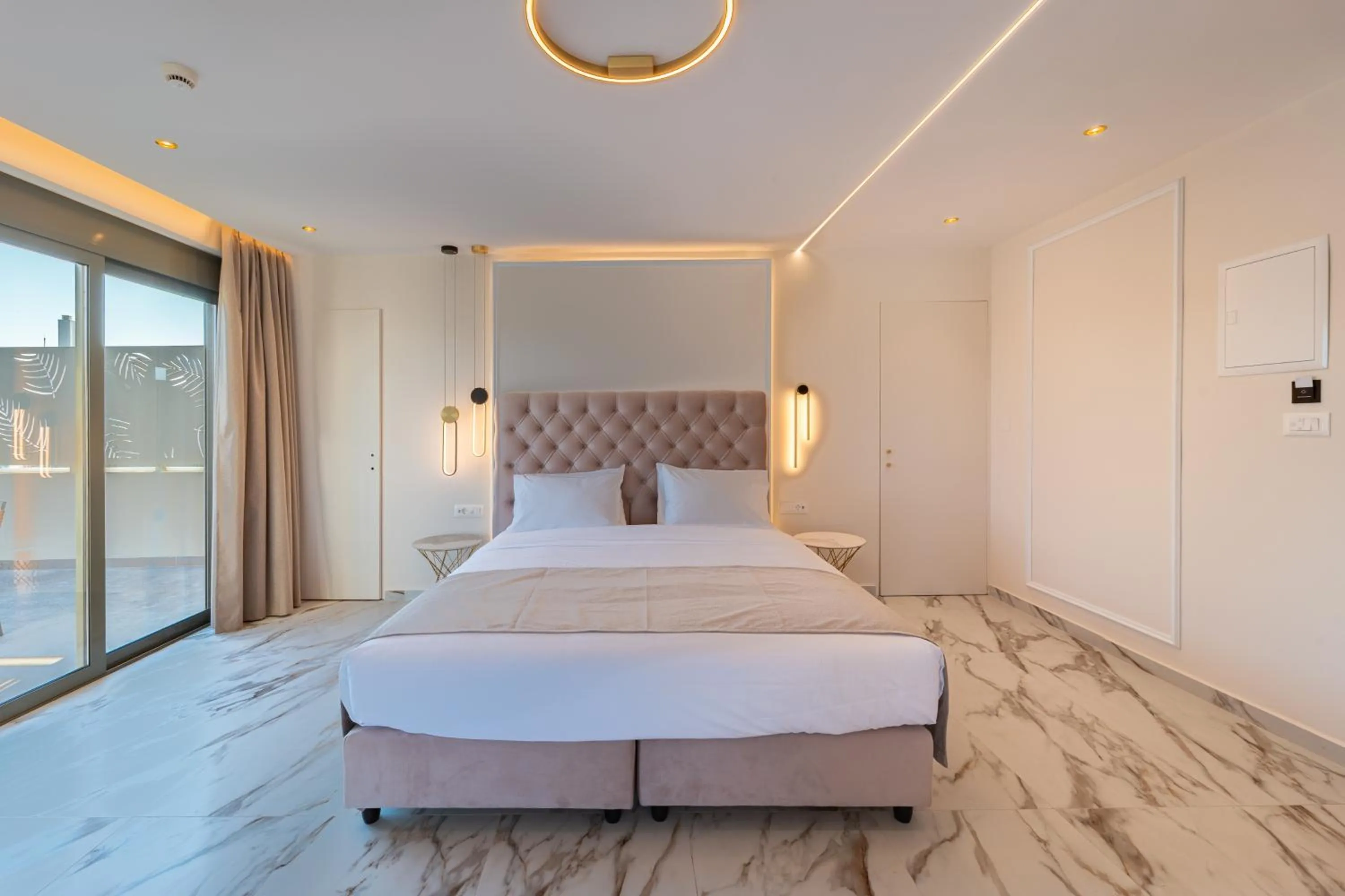 Bed in Philia Center Suites