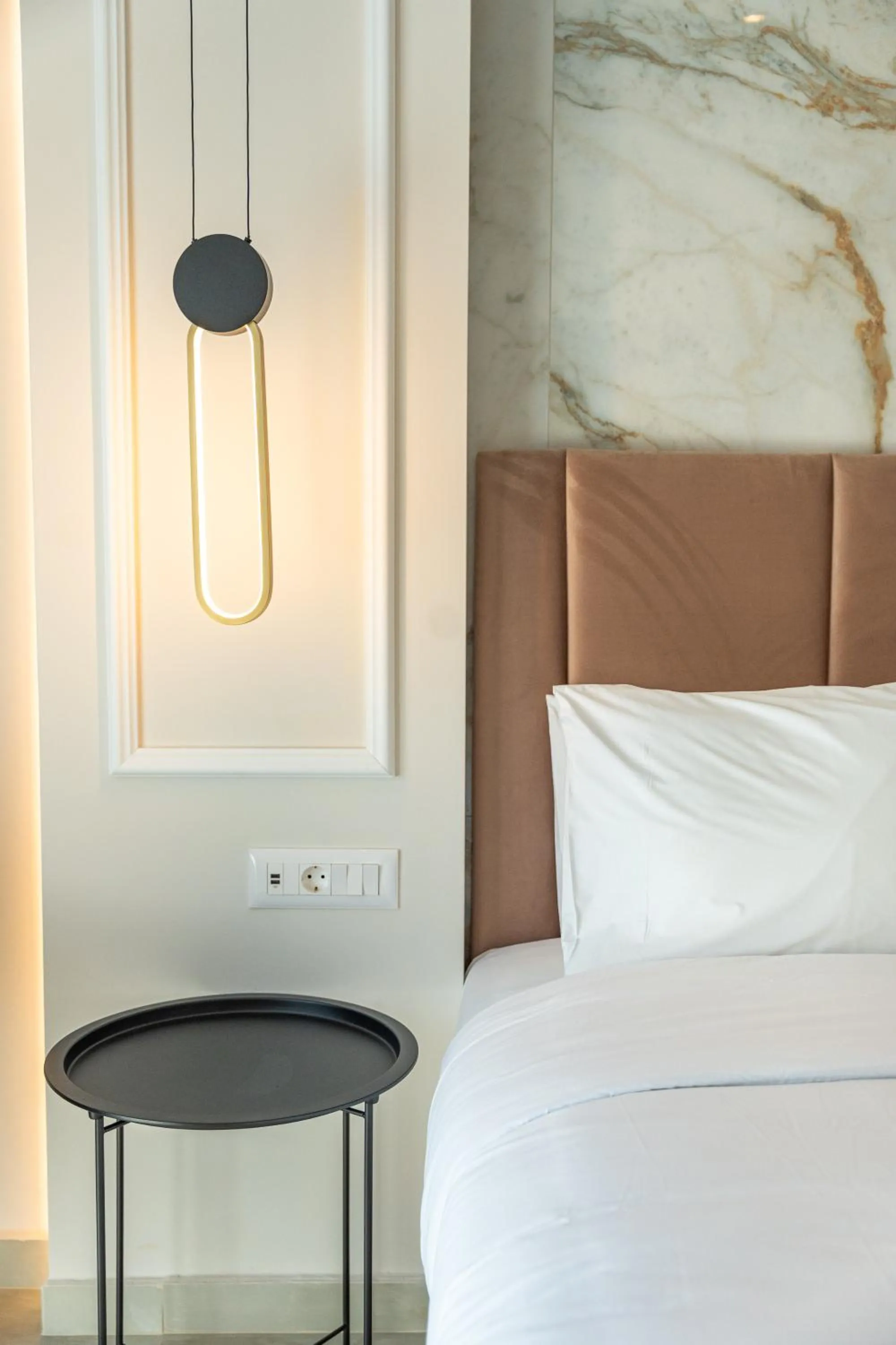 Bed in Philia Center Suites