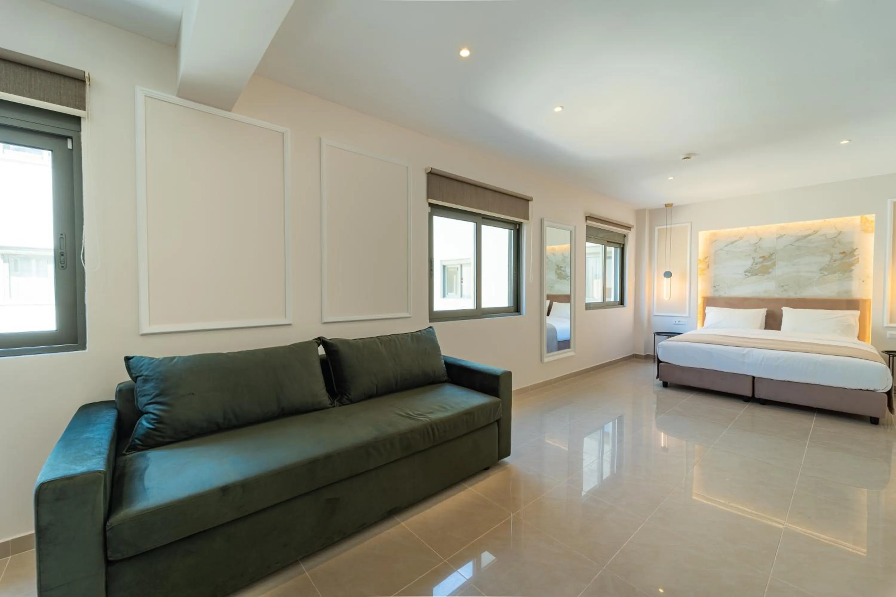 Seating area, Bed in Philia Center Suites