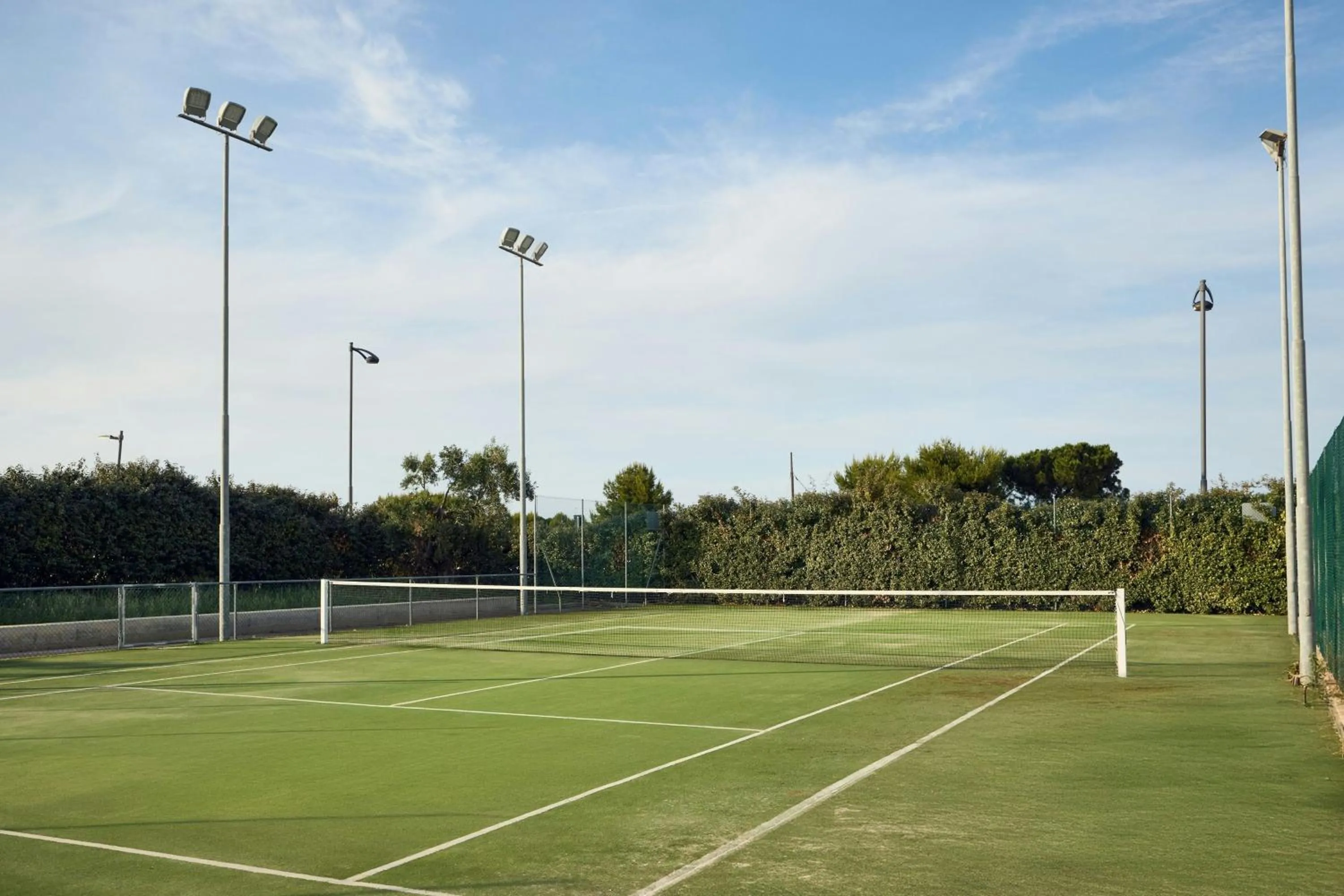 Tennis court in Cala Ponte, a Tribute Portfolio Hotel