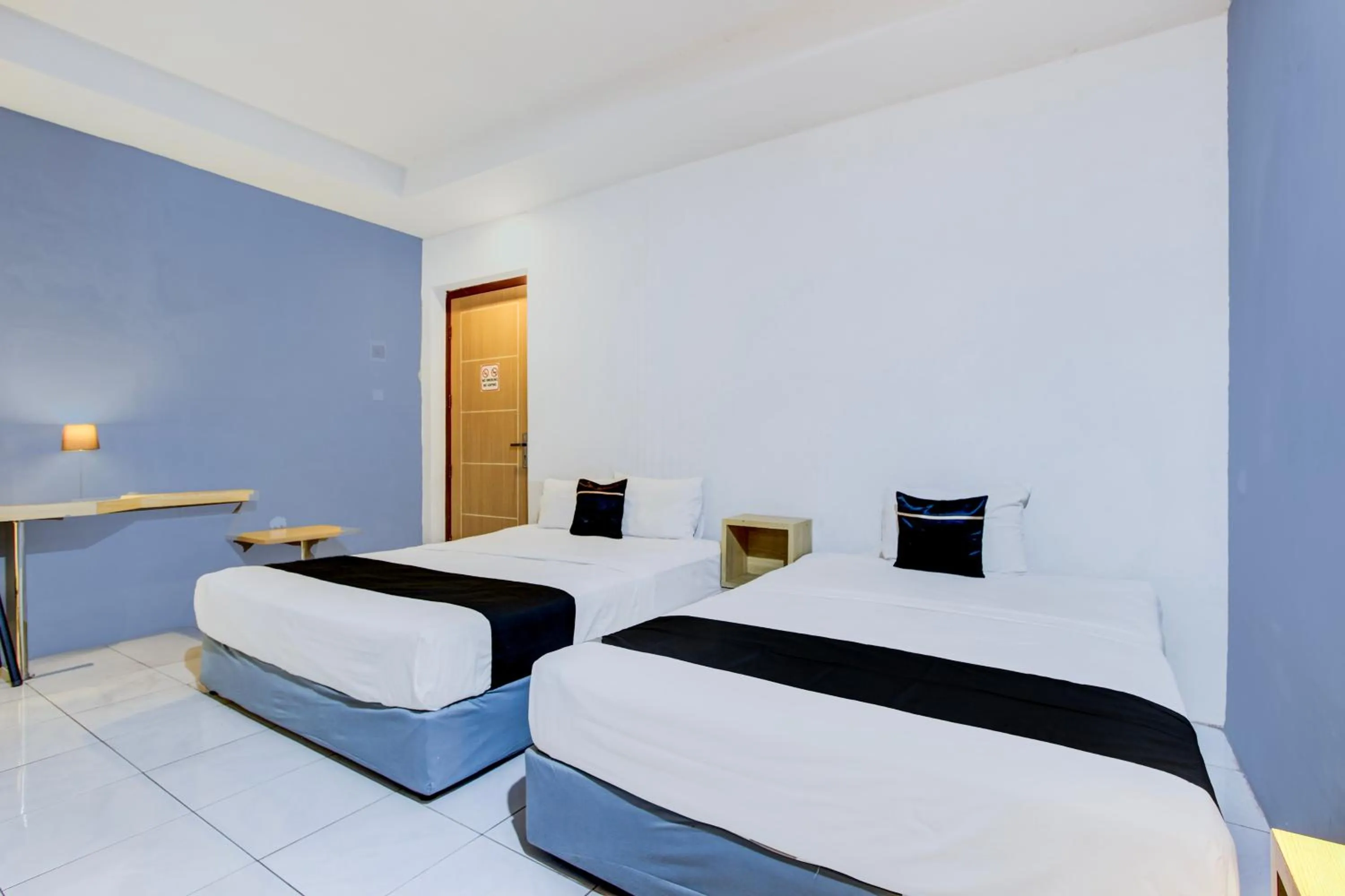 Photo of the whole room, Bed in Hotel O Tegal near near Pacific Mall Tegal formerly Hugo Suites Family