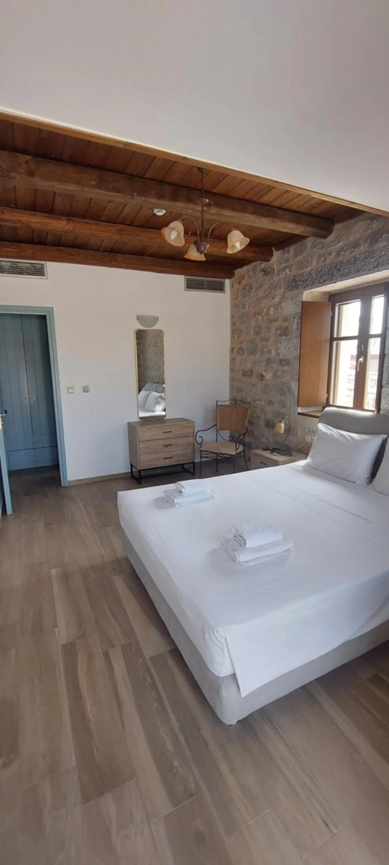 Bed in Koukouri Suites