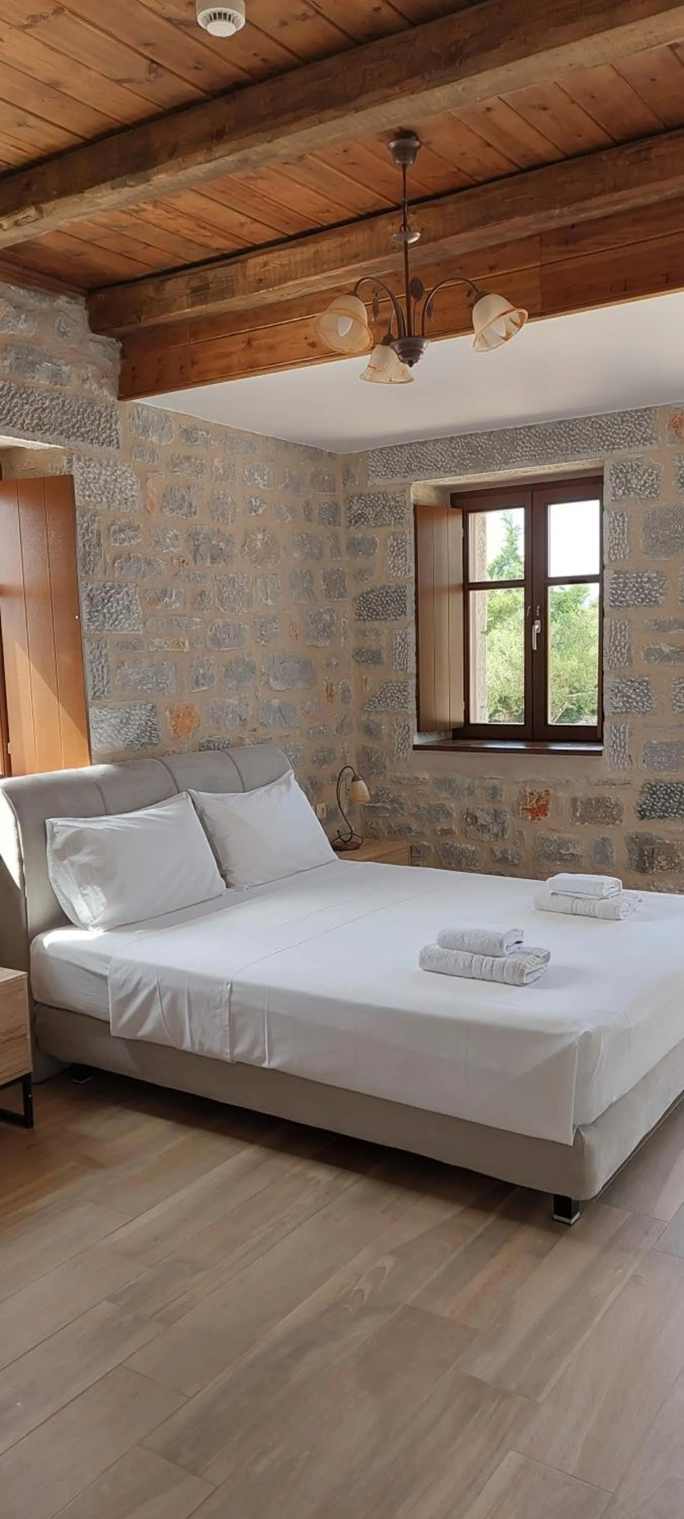 Bed in Koukouri Suites