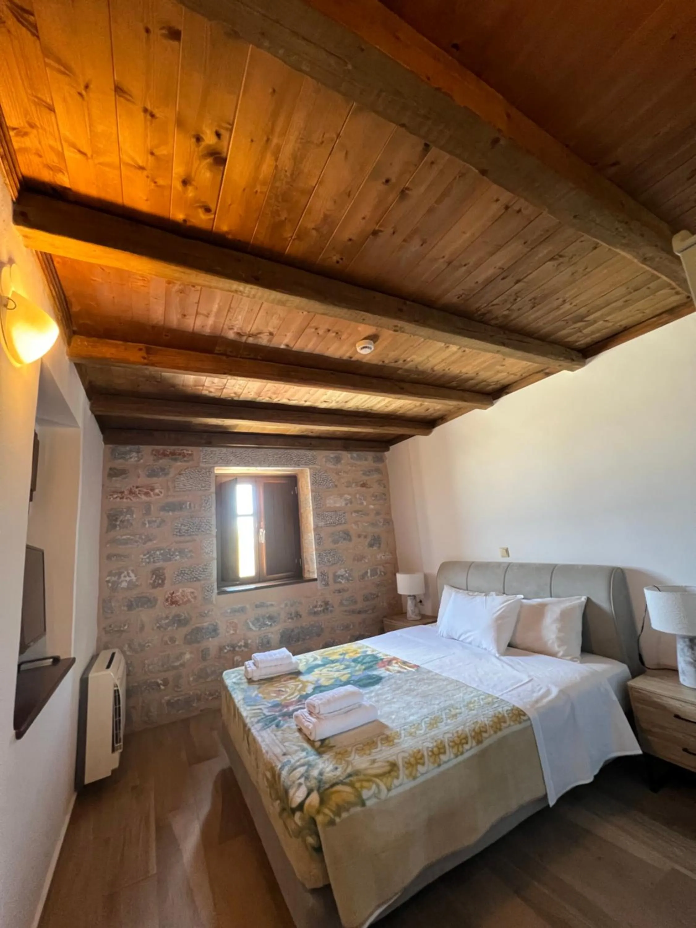 Bed in Koukouri Suites
