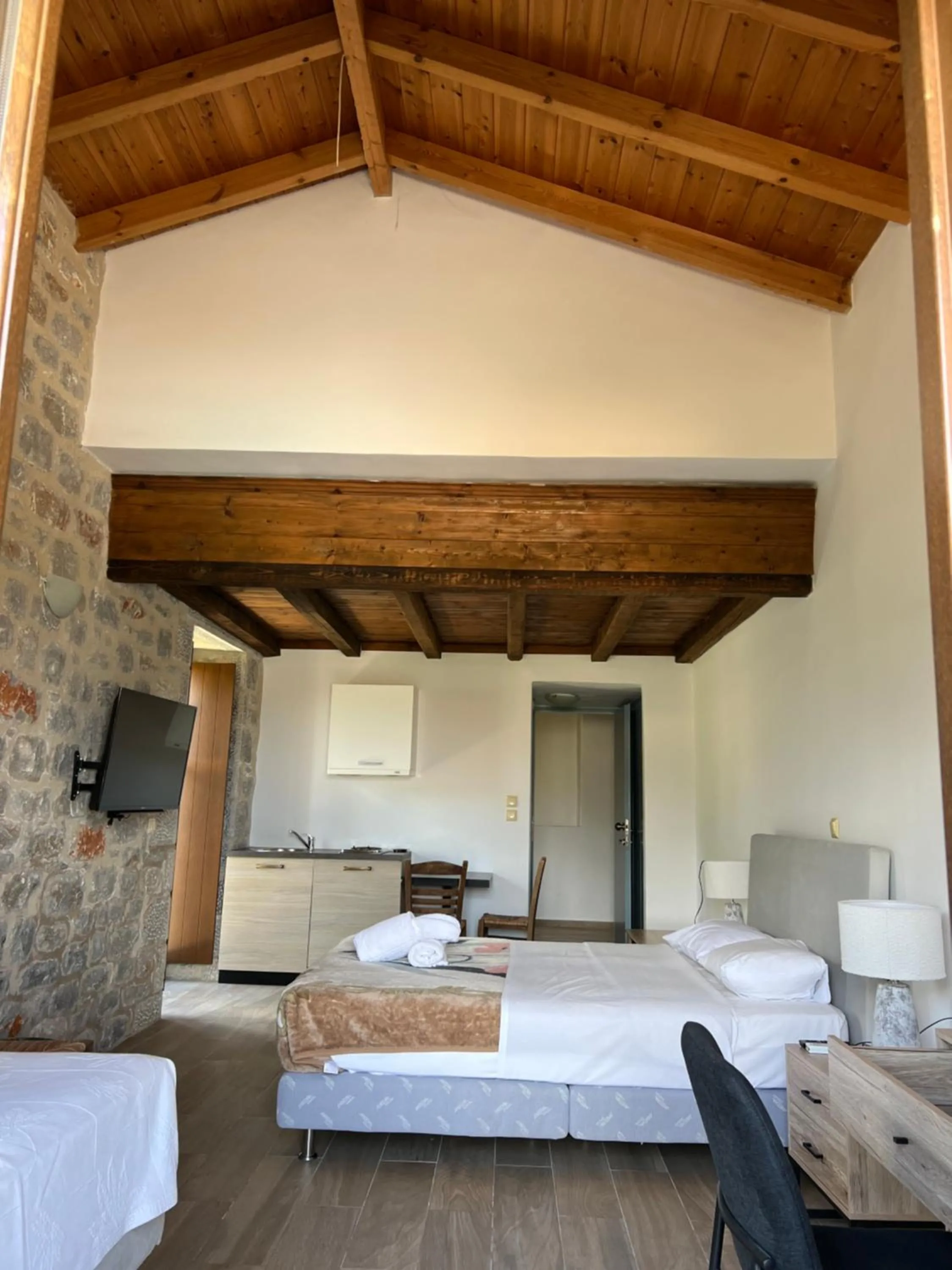 Bed in Koukouri Suites