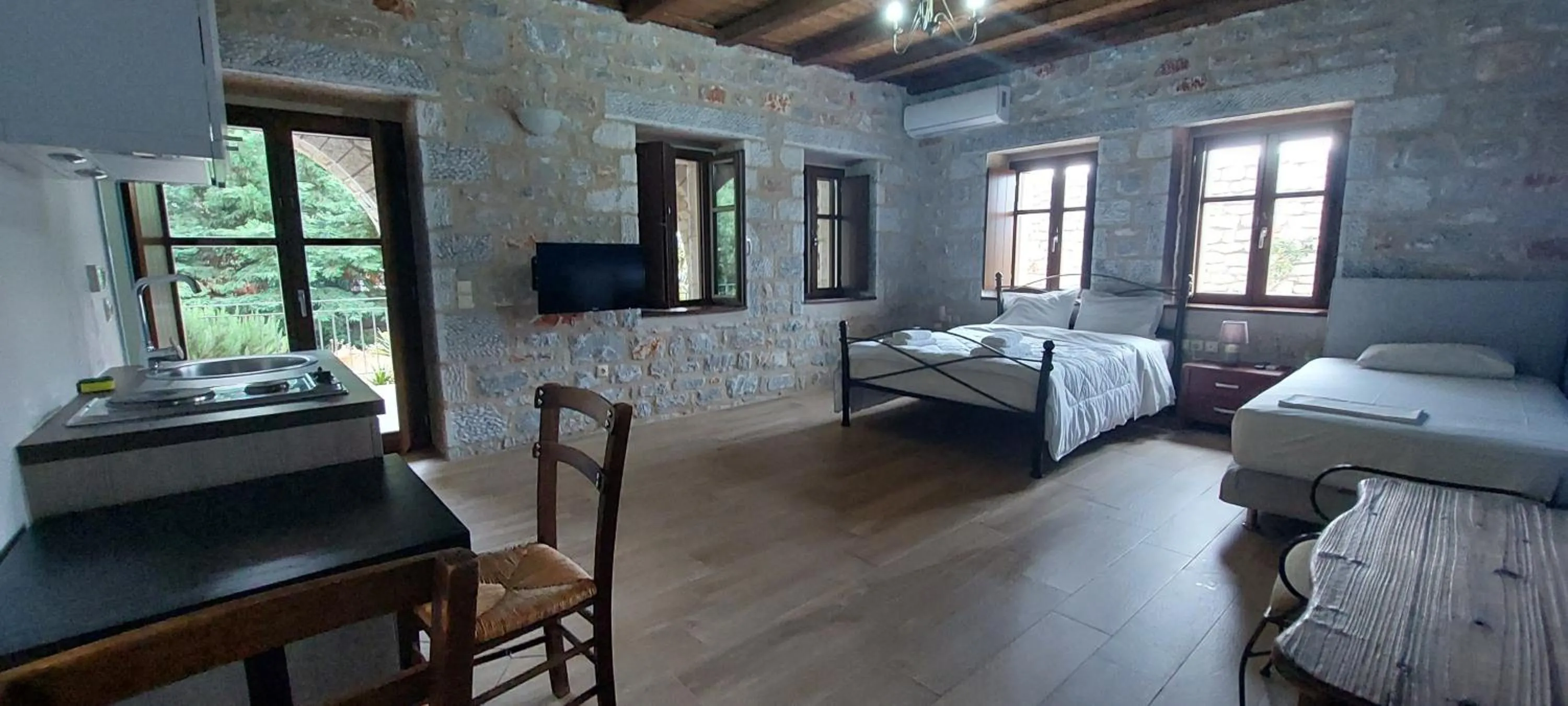 Bed in Koukouri Suites