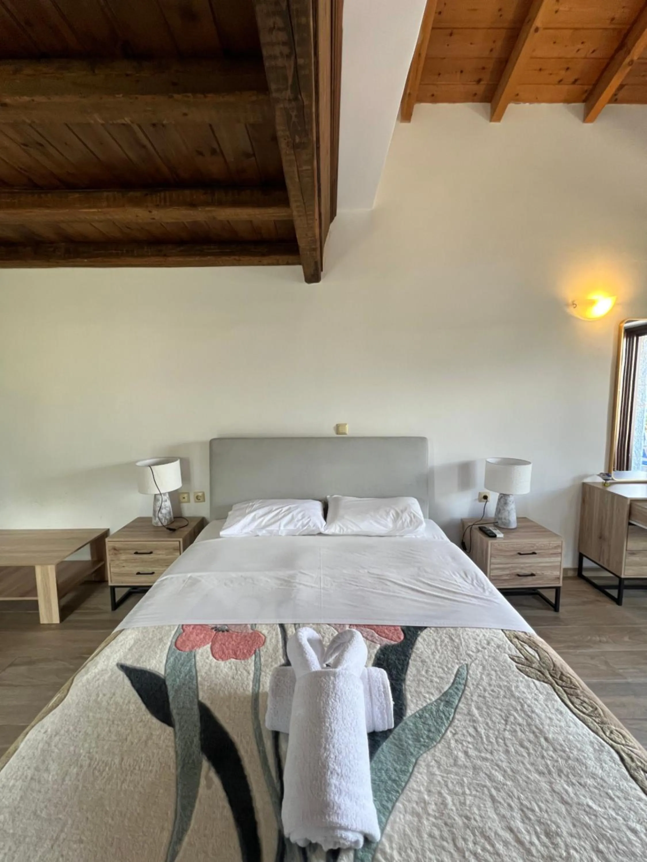 Bed in Koukouri Suites