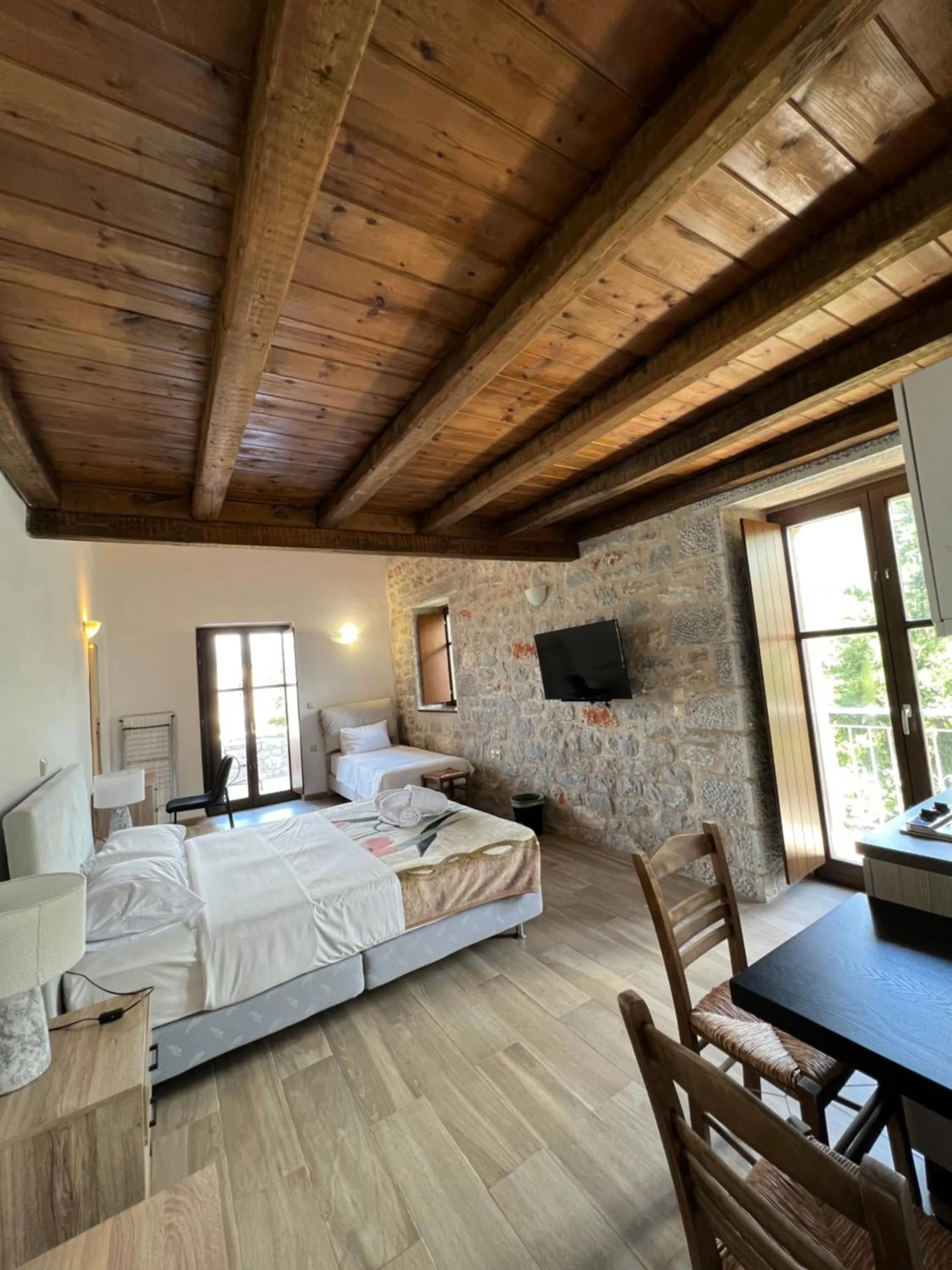 Bed in Koukouri Suites