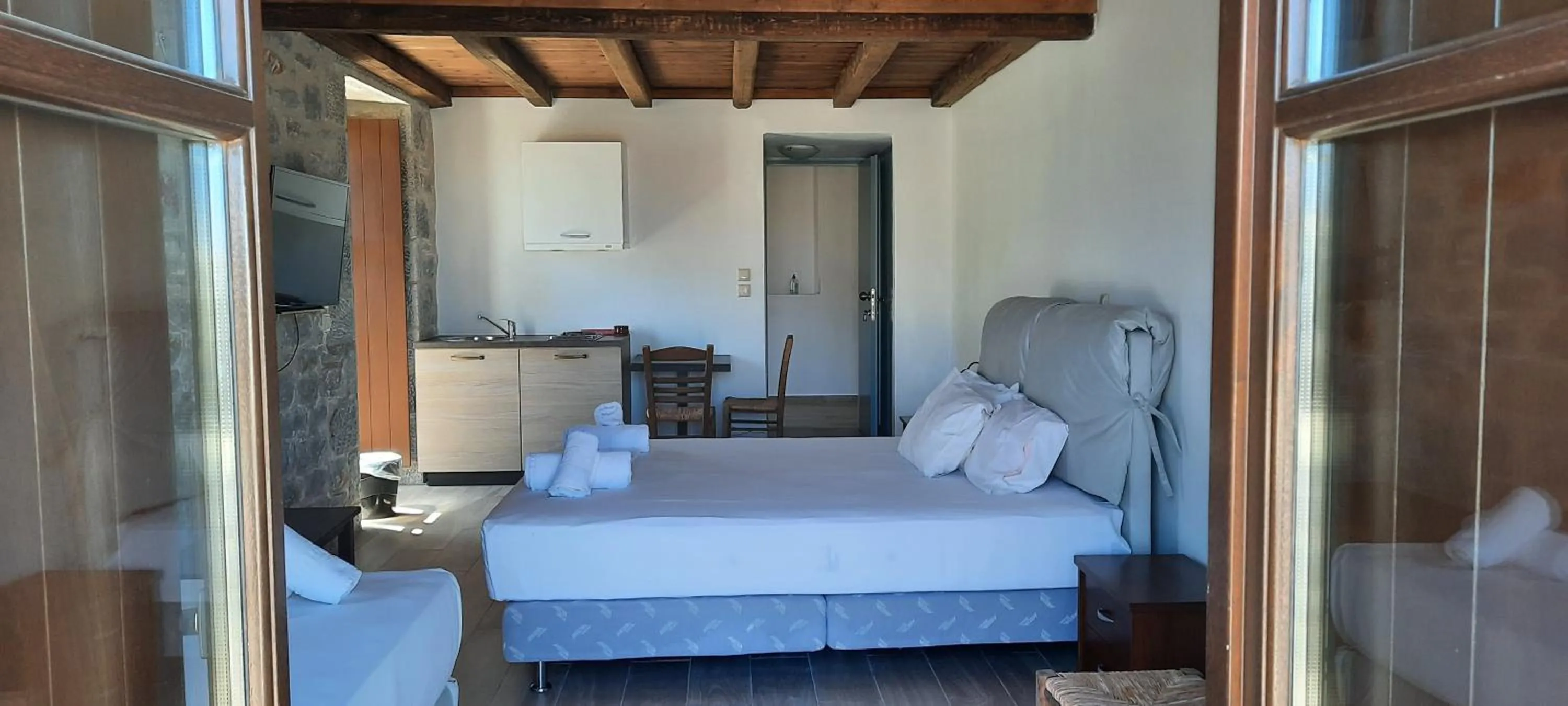 Bed in Koukouri Suites