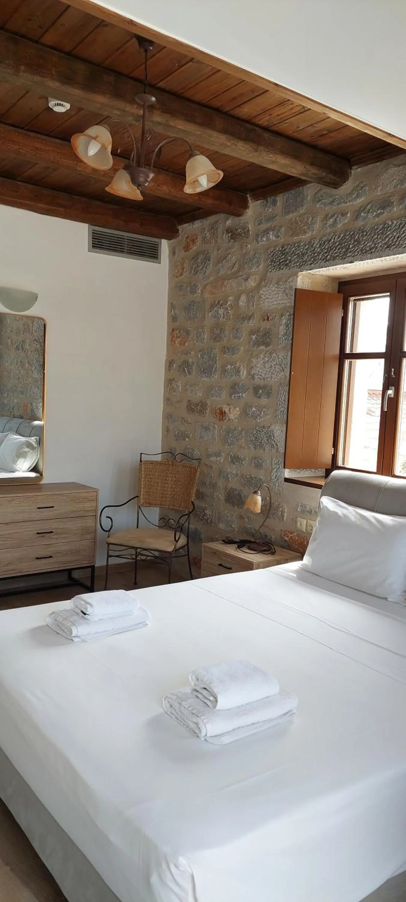 Bed in Koukouri Suites
