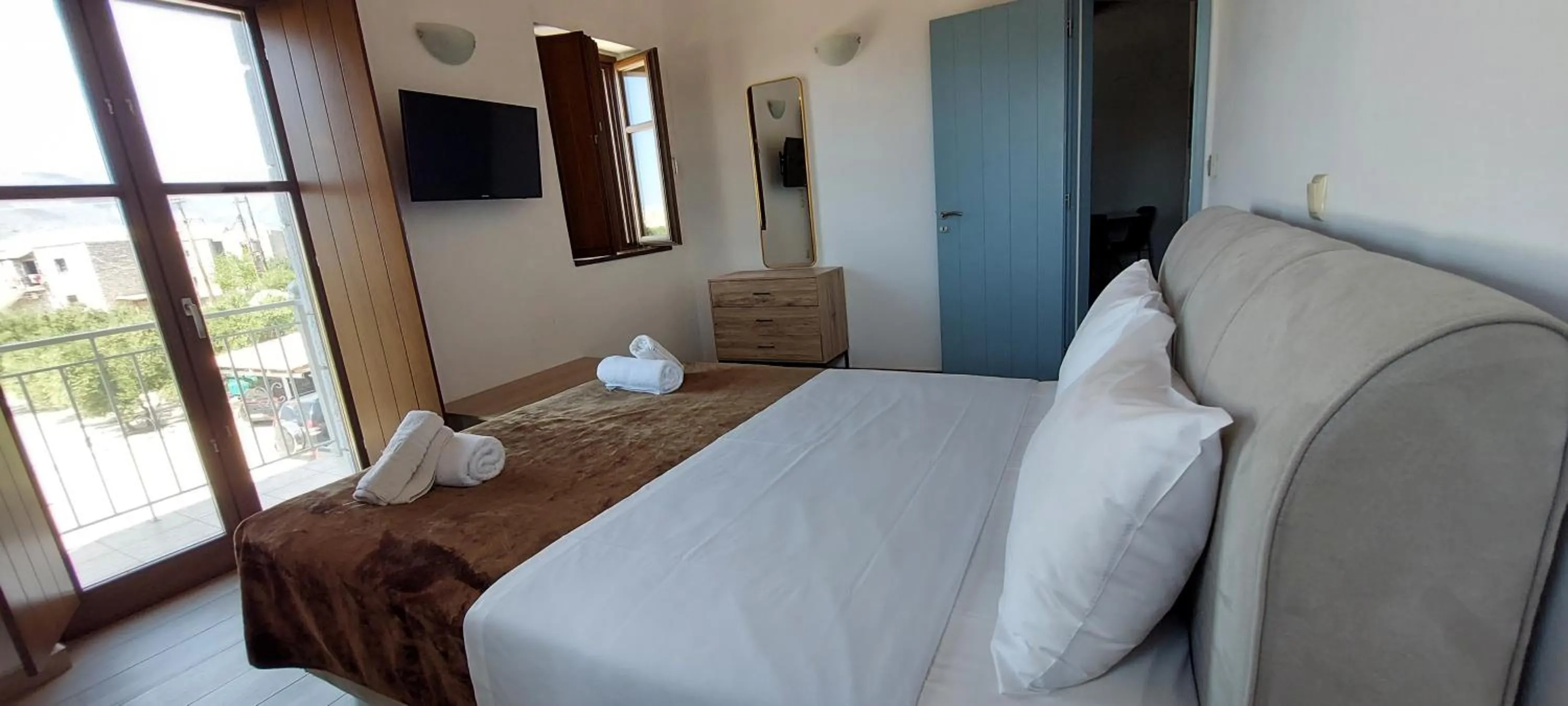 Bed in Koukouri Suites