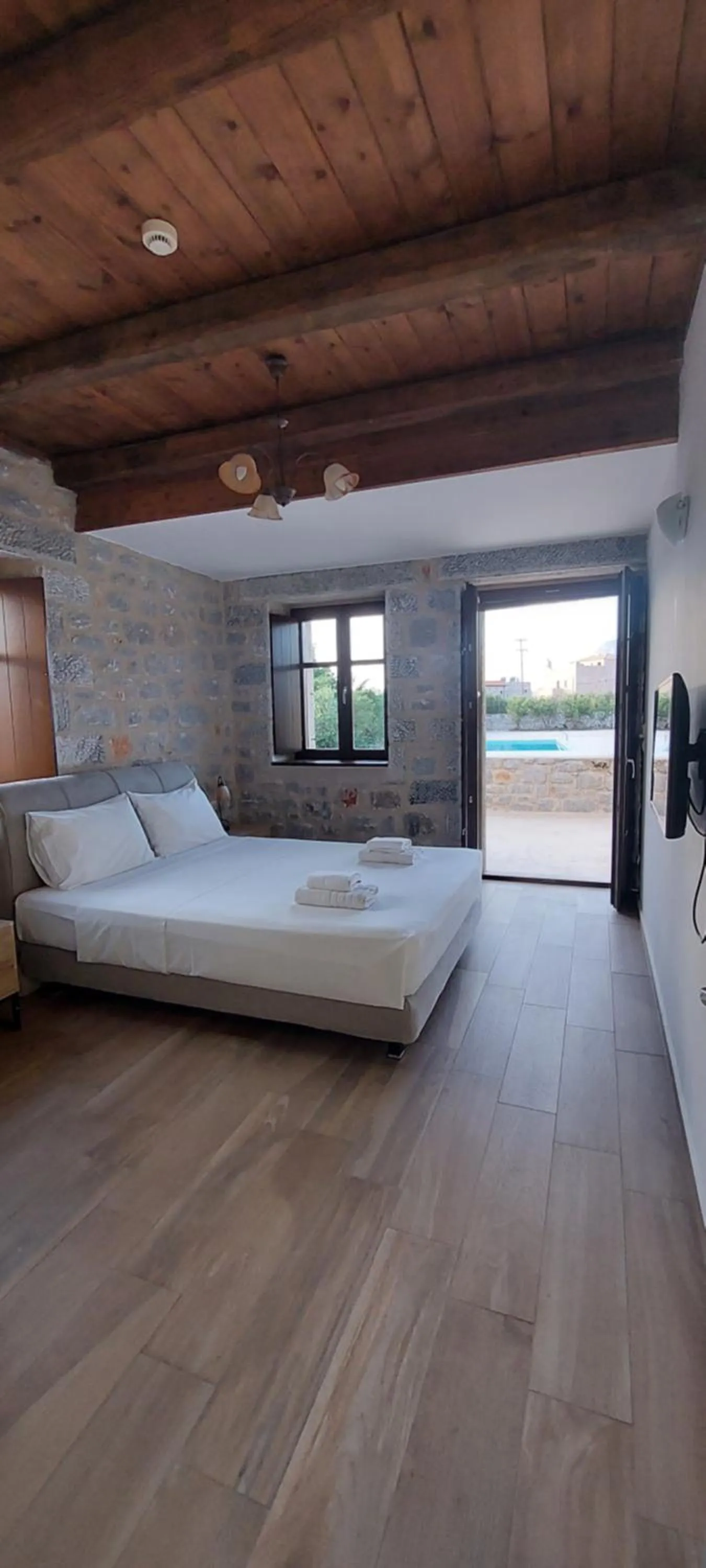 Bed in Koukouri Suites