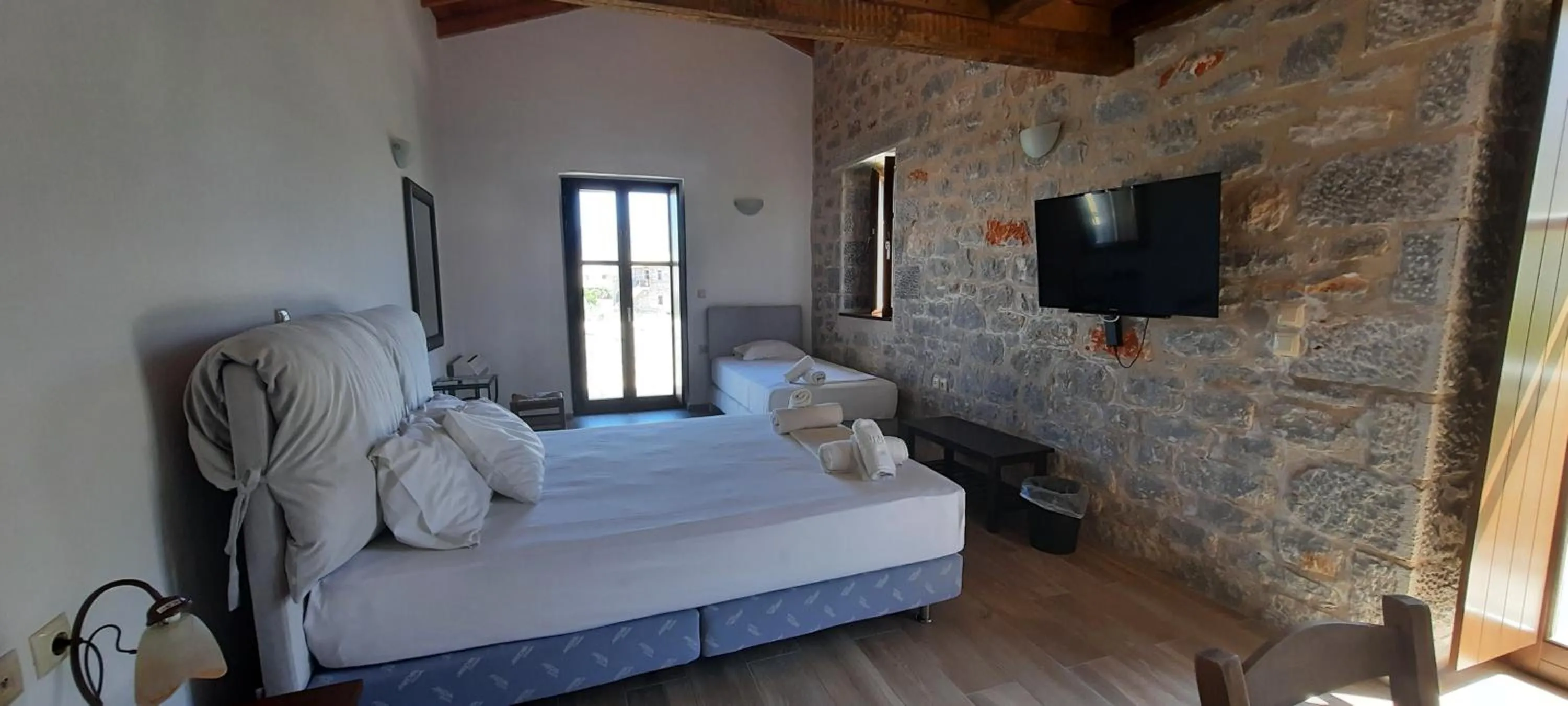 Bed in Koukouri Suites