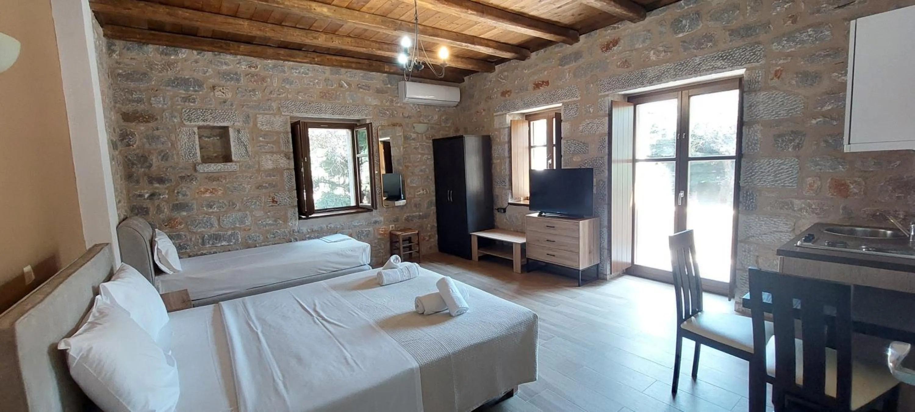 Bed in Koukouri Suites