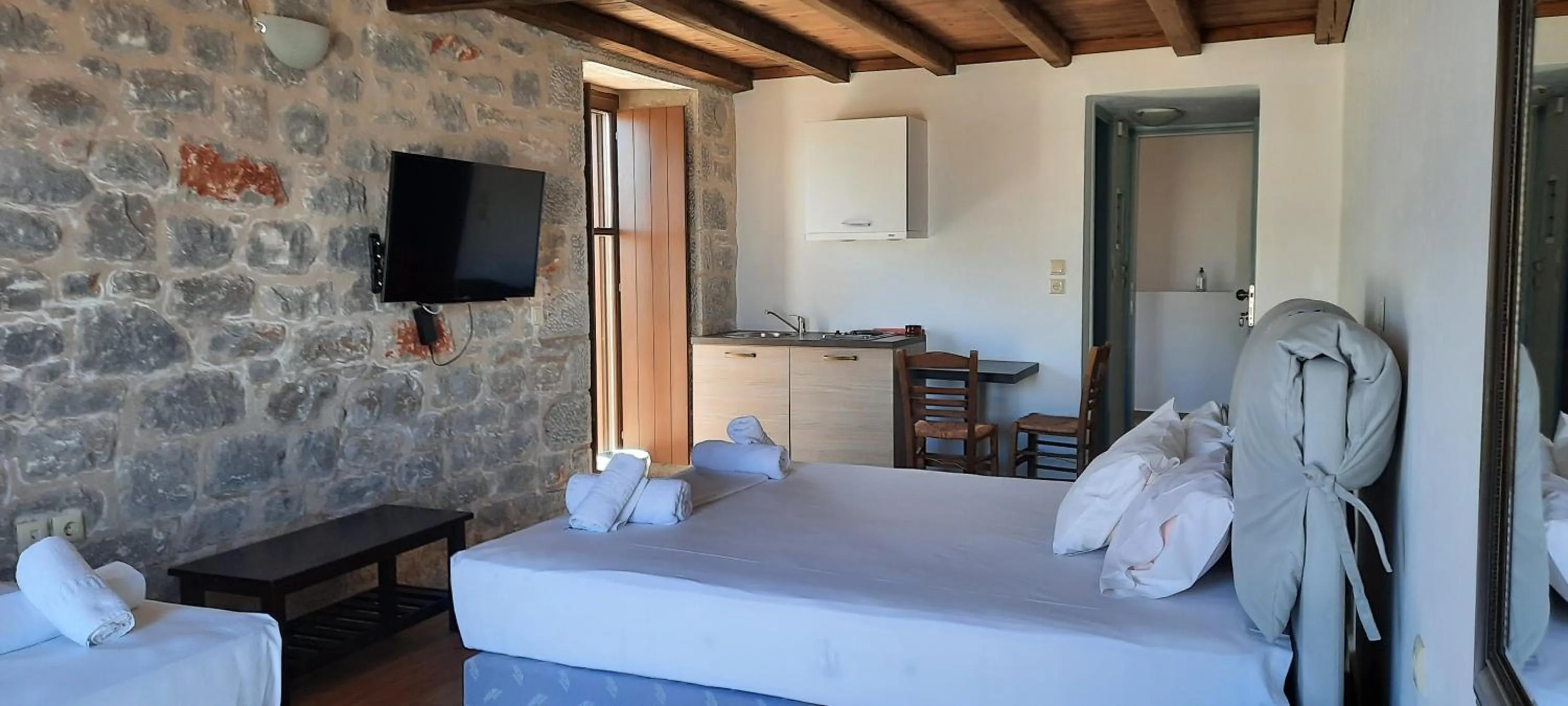 Bed in Koukouri Suites