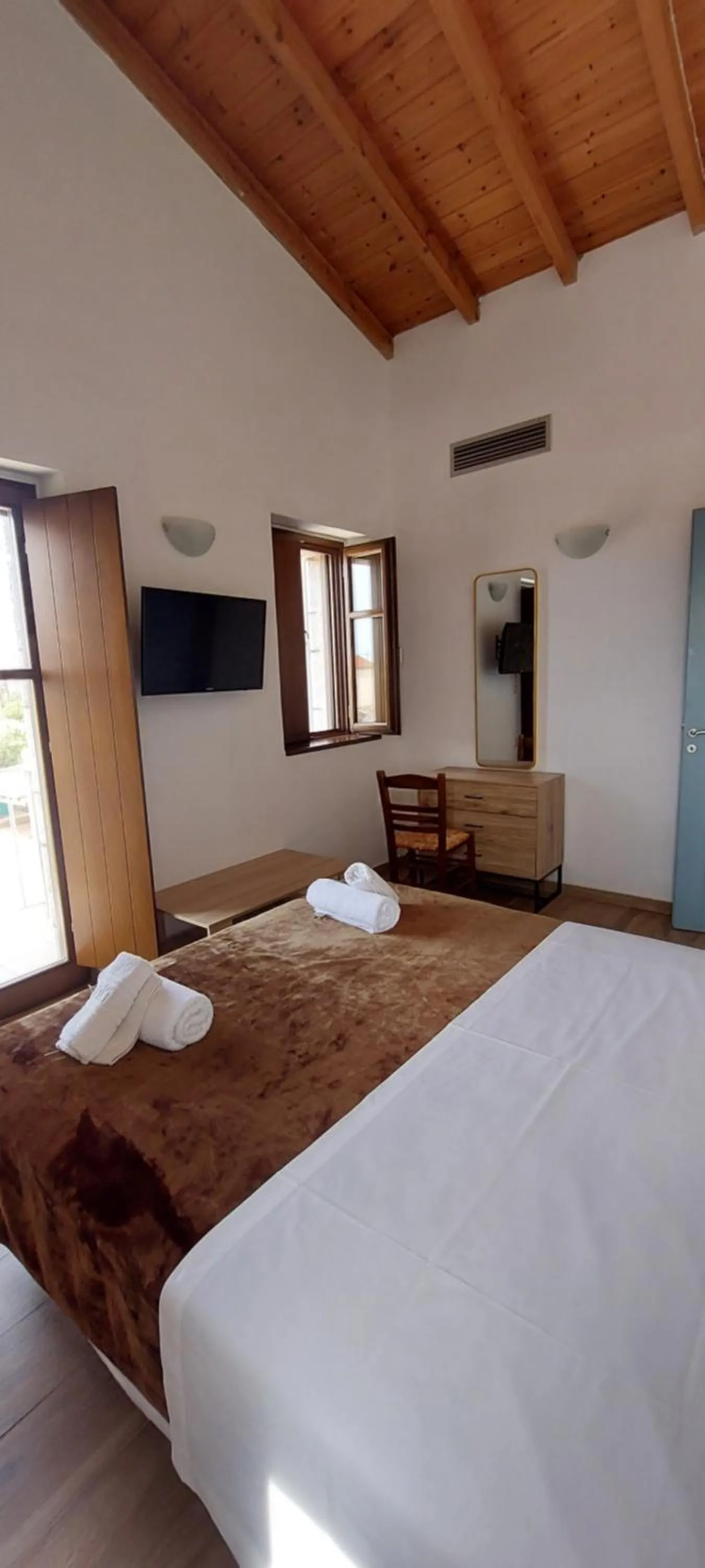 Bed in Koukouri Suites
