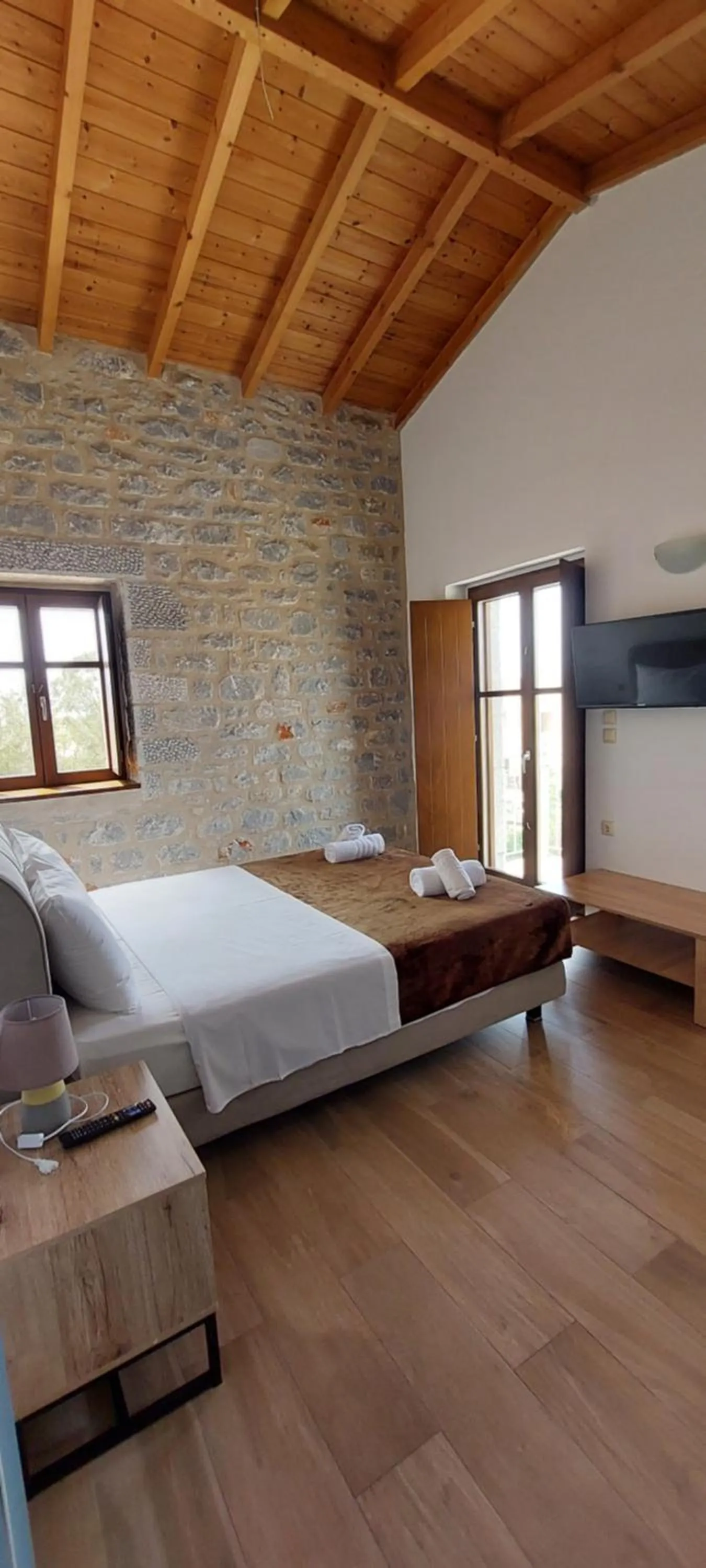 Bed in Koukouri Suites