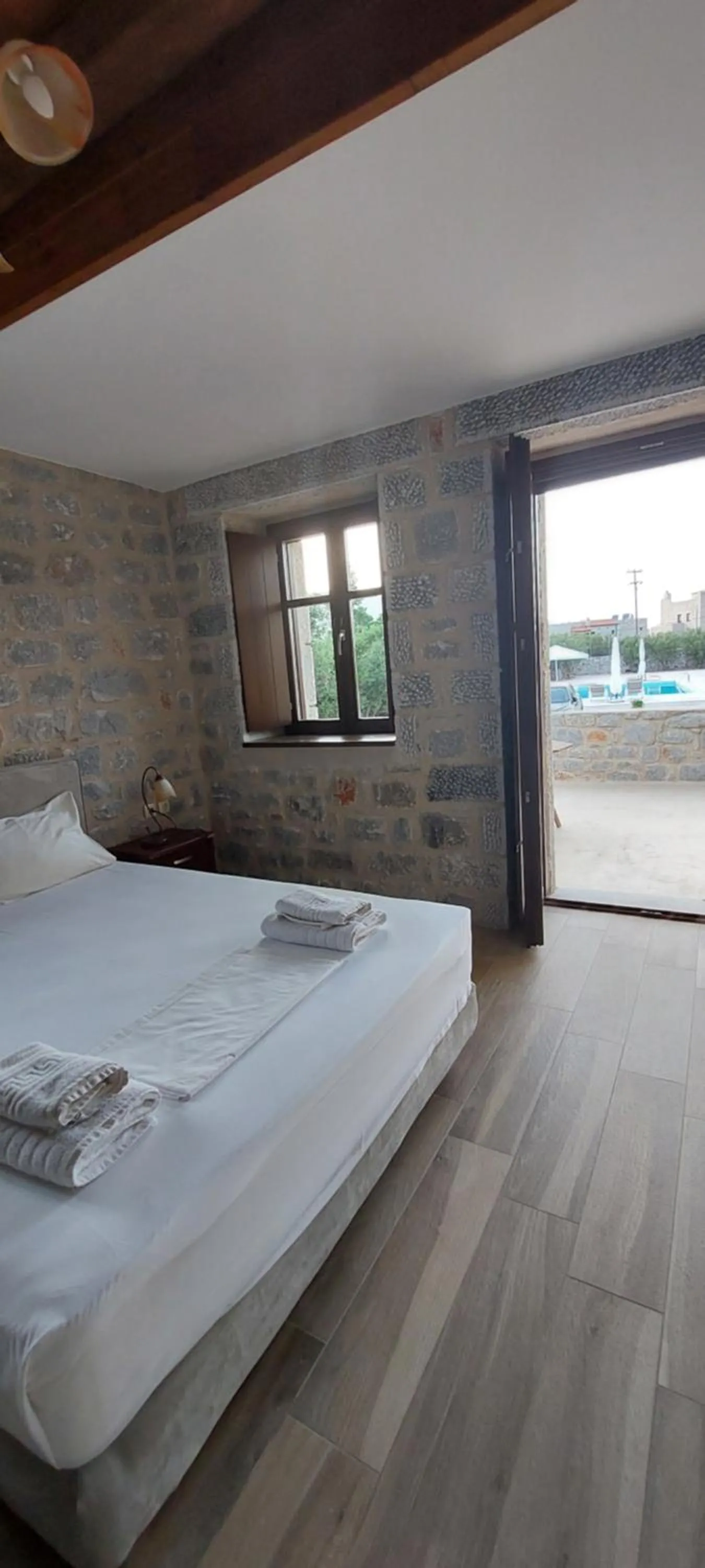 Bed in Koukouri Suites