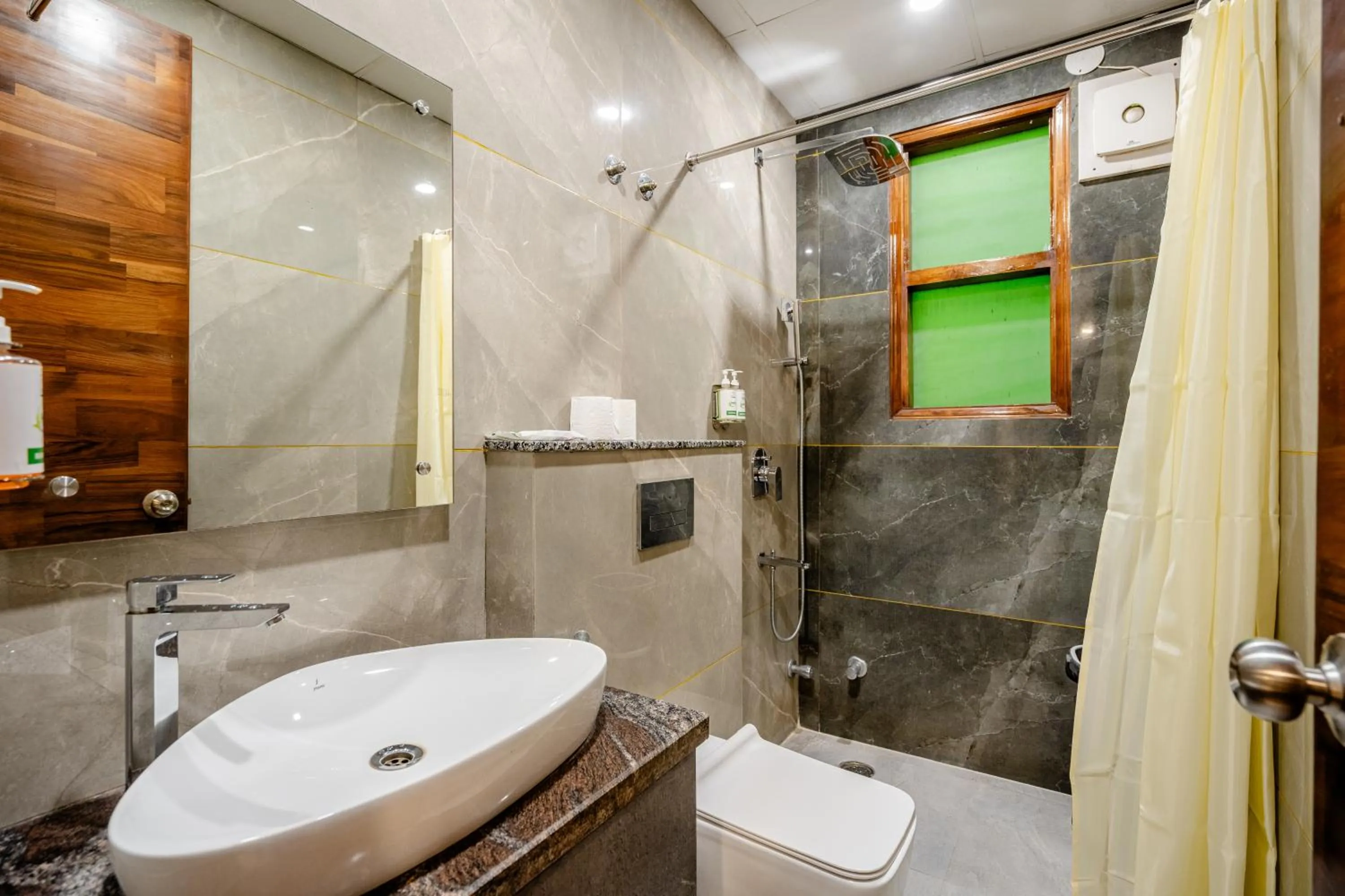 Bathroom in Lime Tree Hotel - Near Medanta Hospital