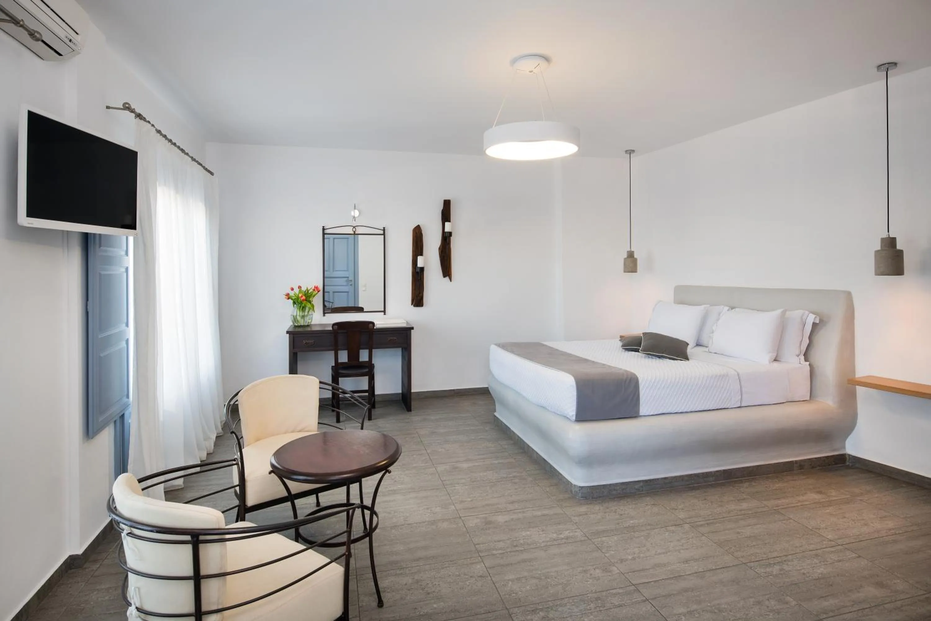 Bed in Apanemo Hotel & Suites