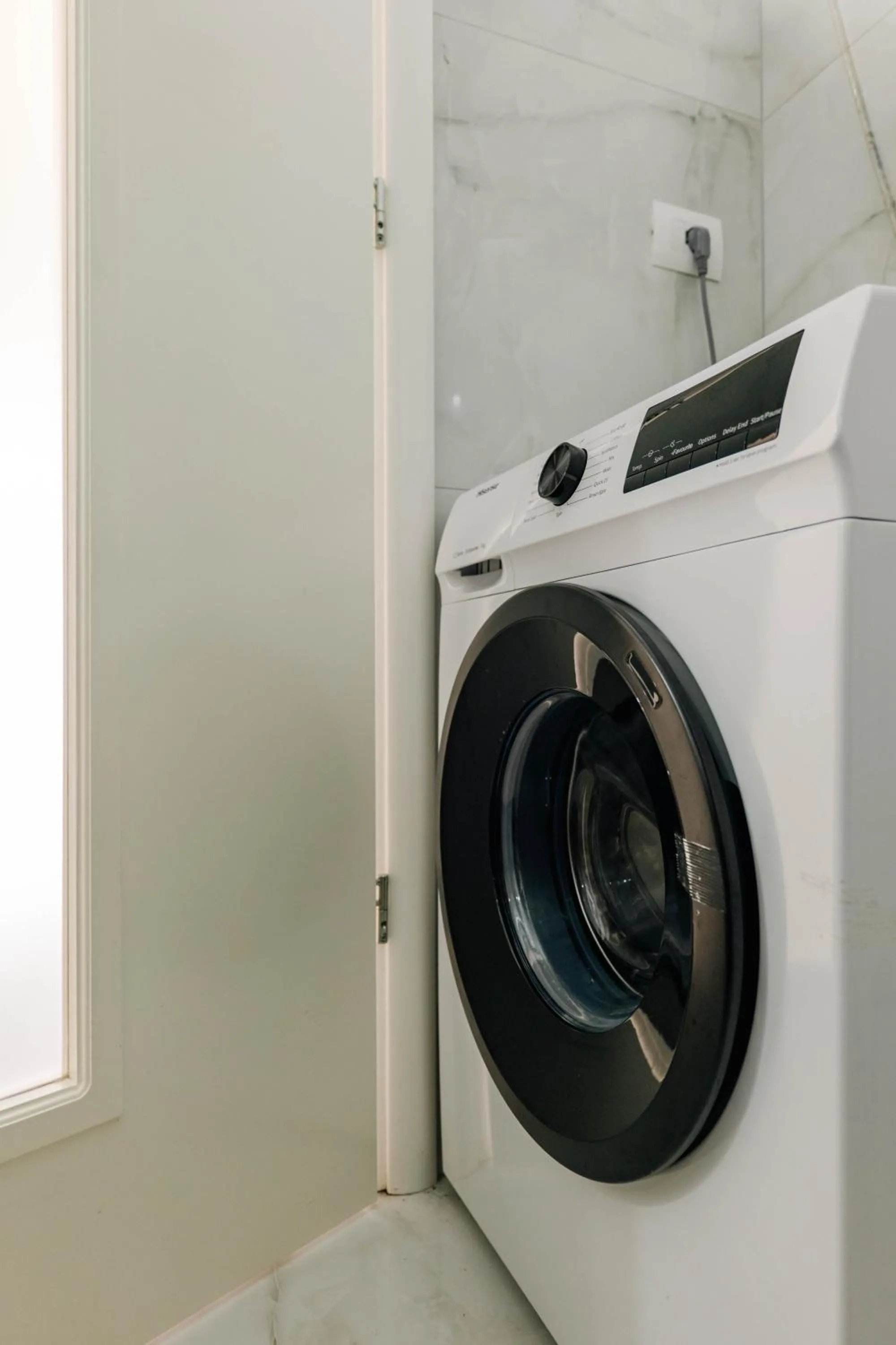 washing machine in StarLight Apartments 2