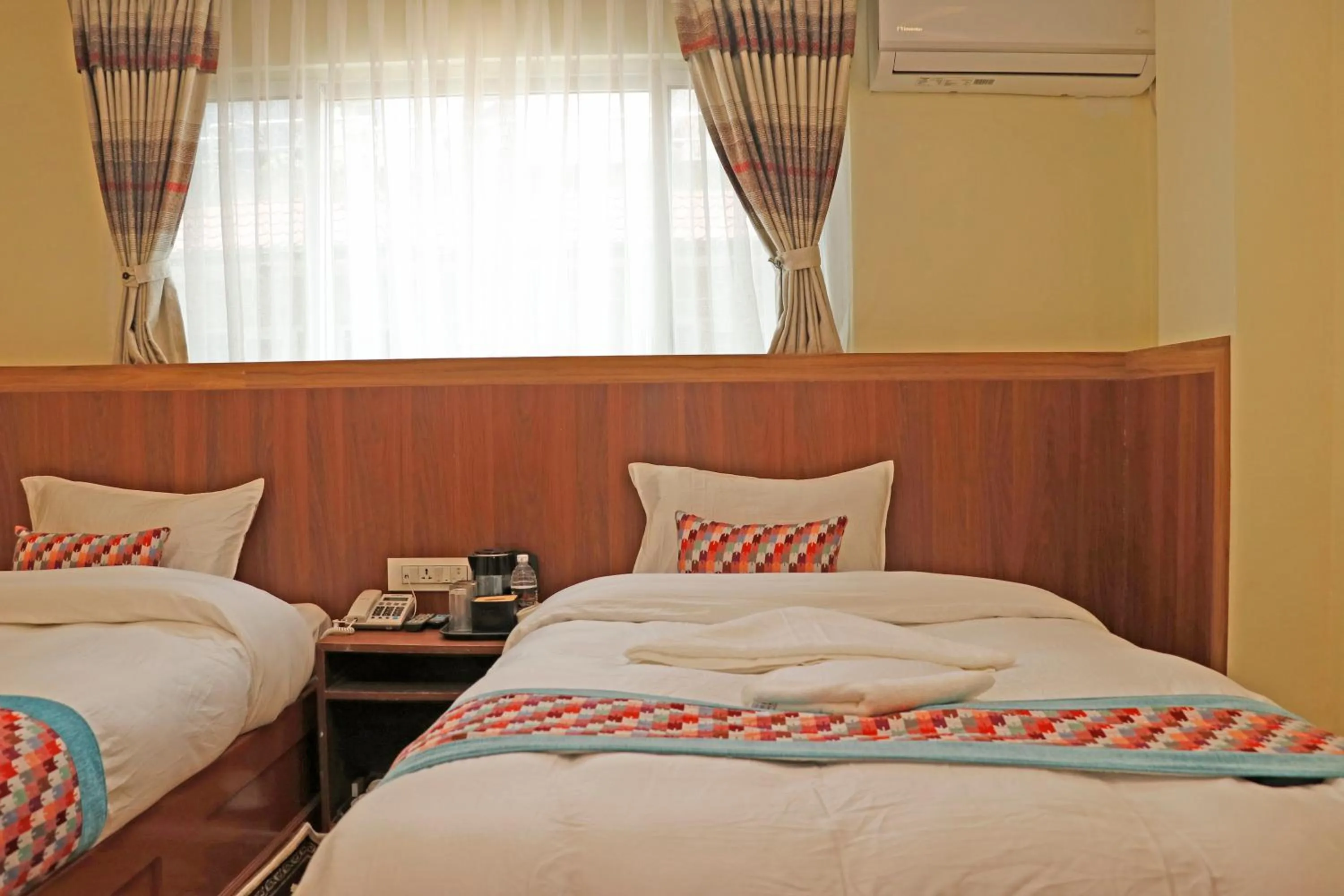 Bed in Hotel Himalayan BTS
