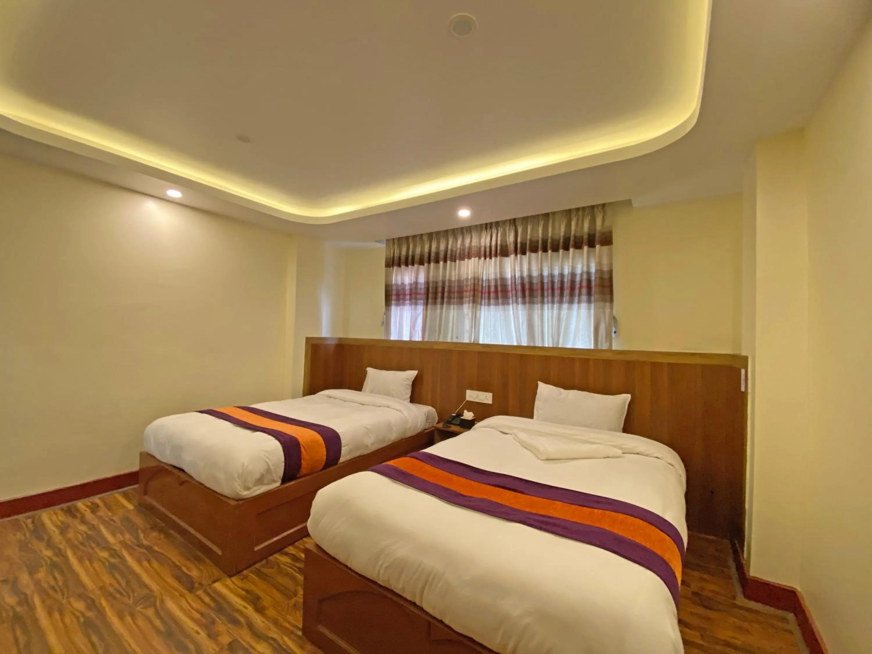 Bed in Hotel Himalayan BTS