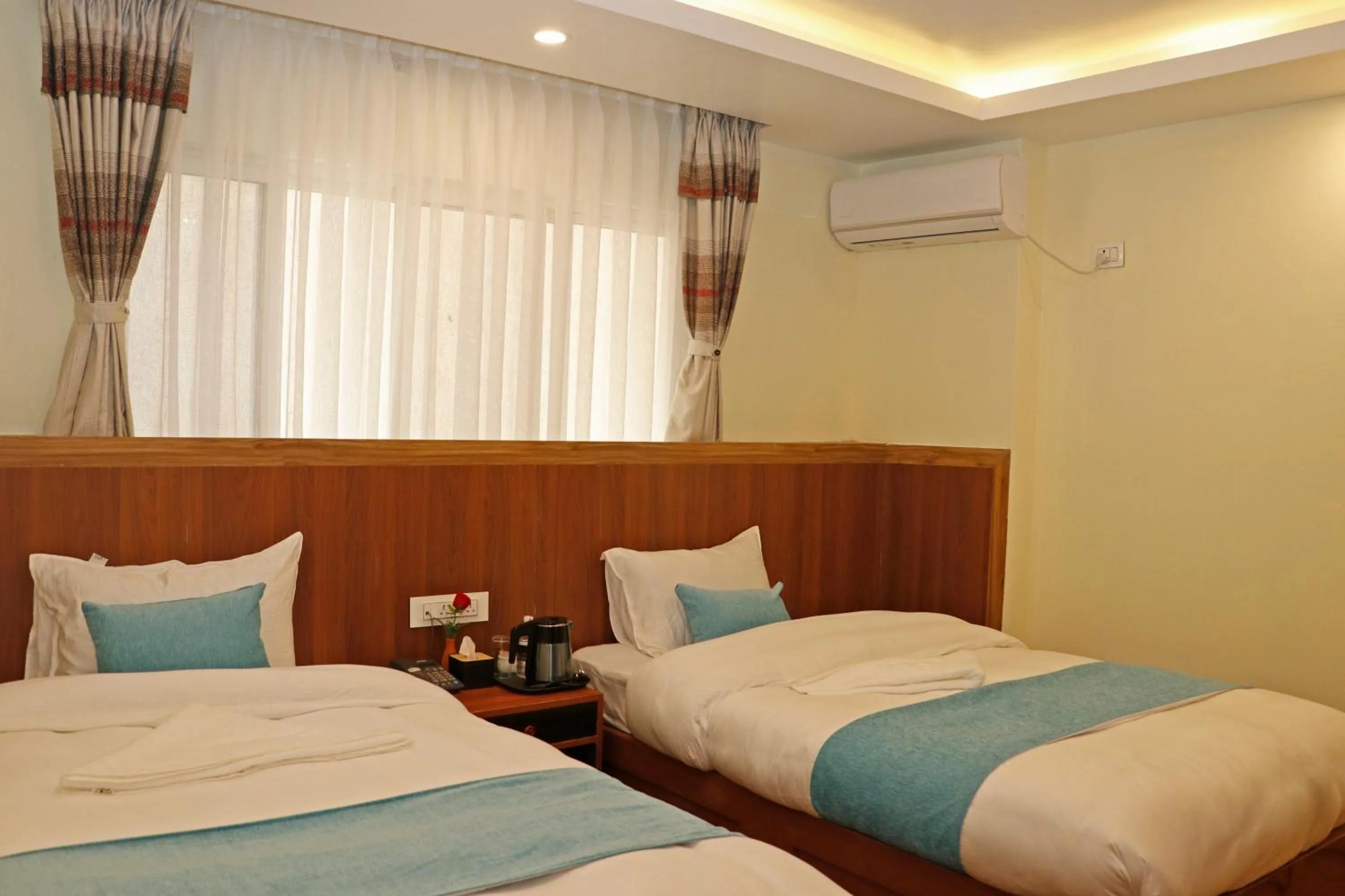 Bed in Hotel Himalayan BTS