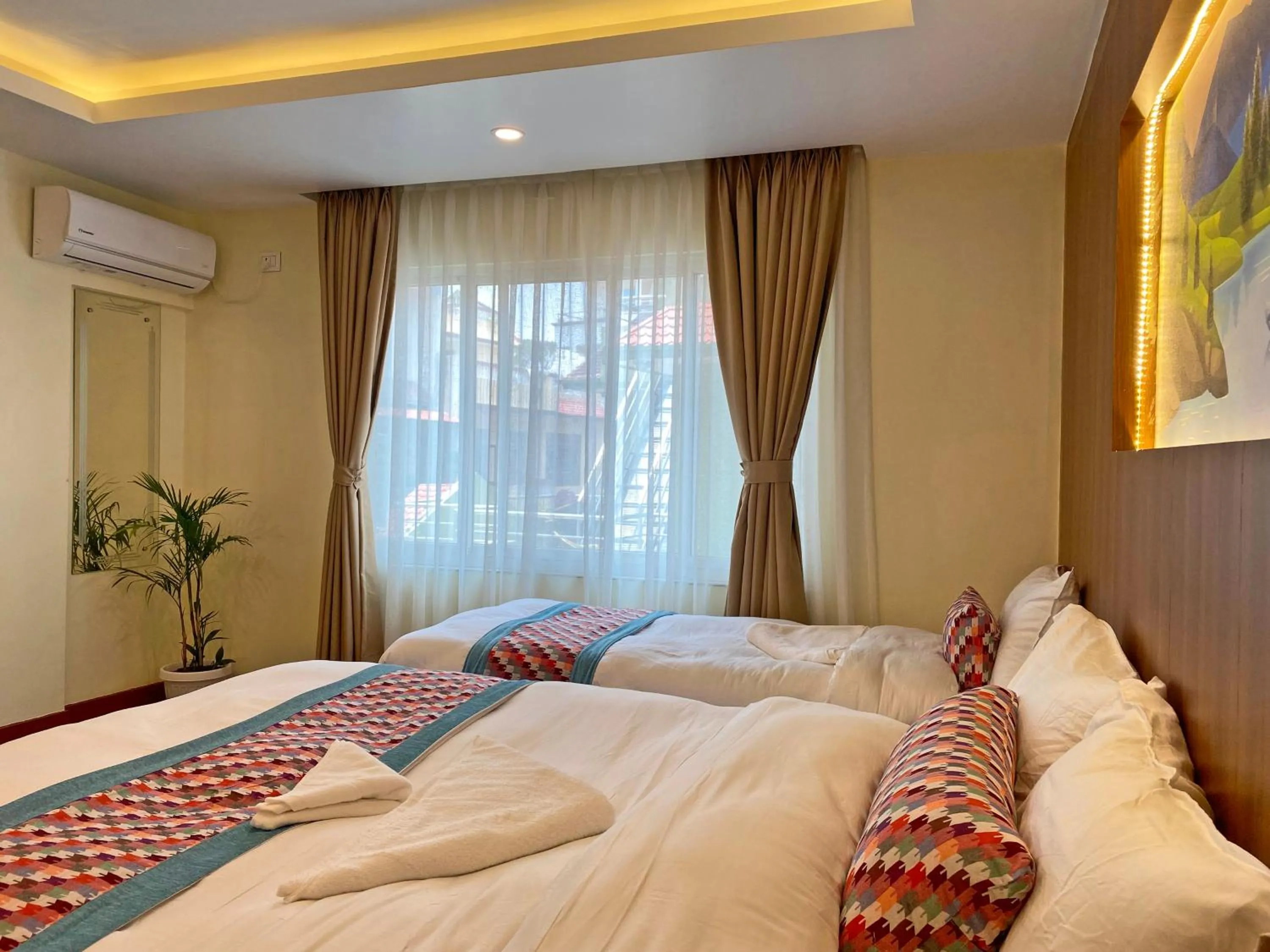 Bed in Hotel Himalayan BTS