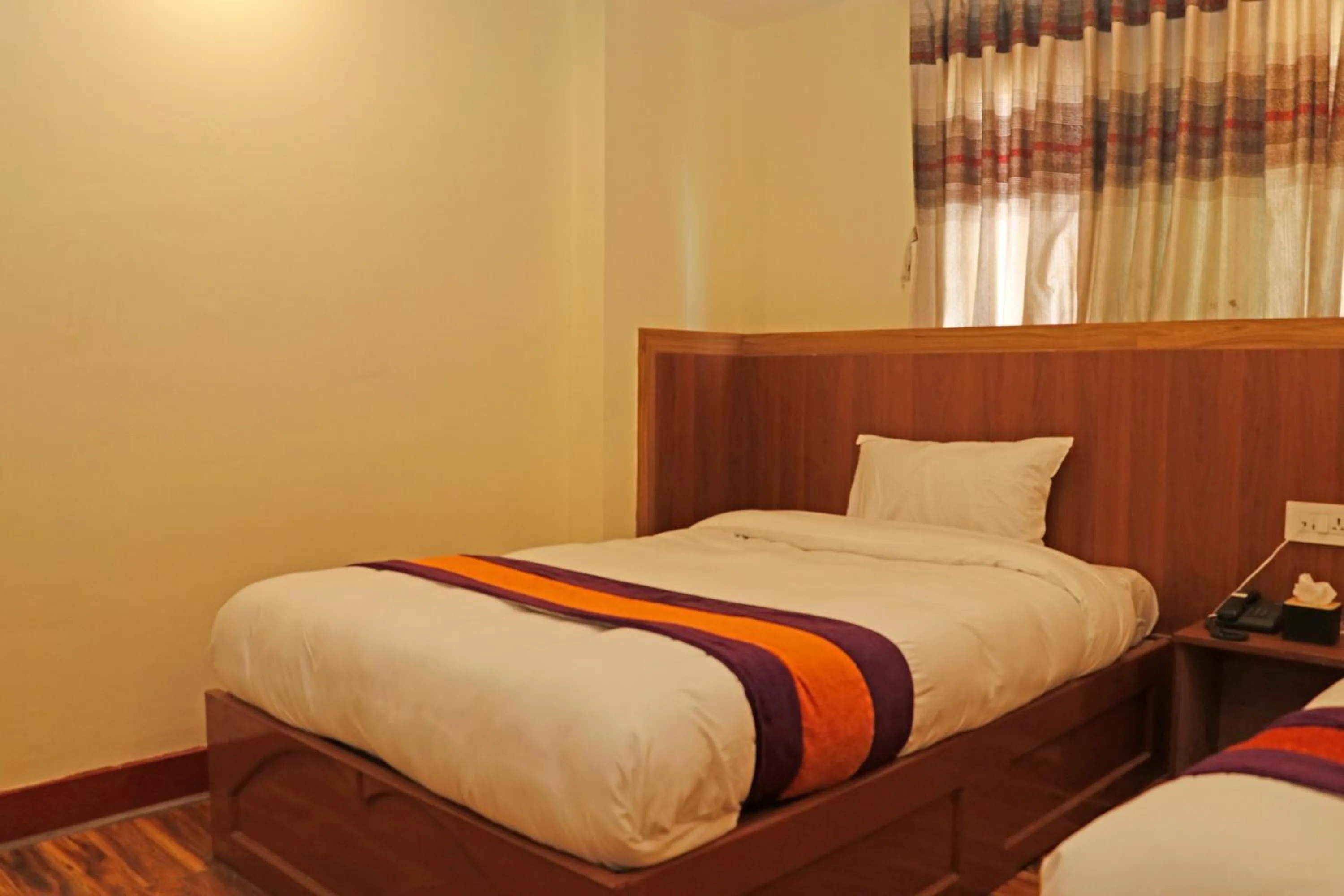 Bed in Hotel Himalayan BTS