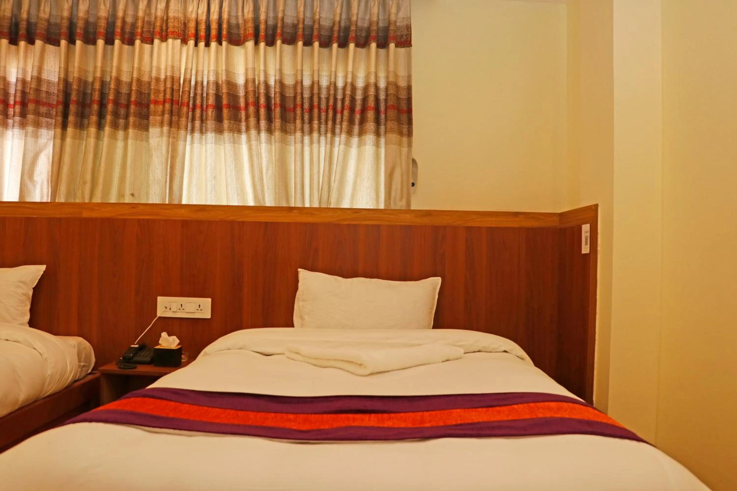 Bed in Hotel Himalayan BTS