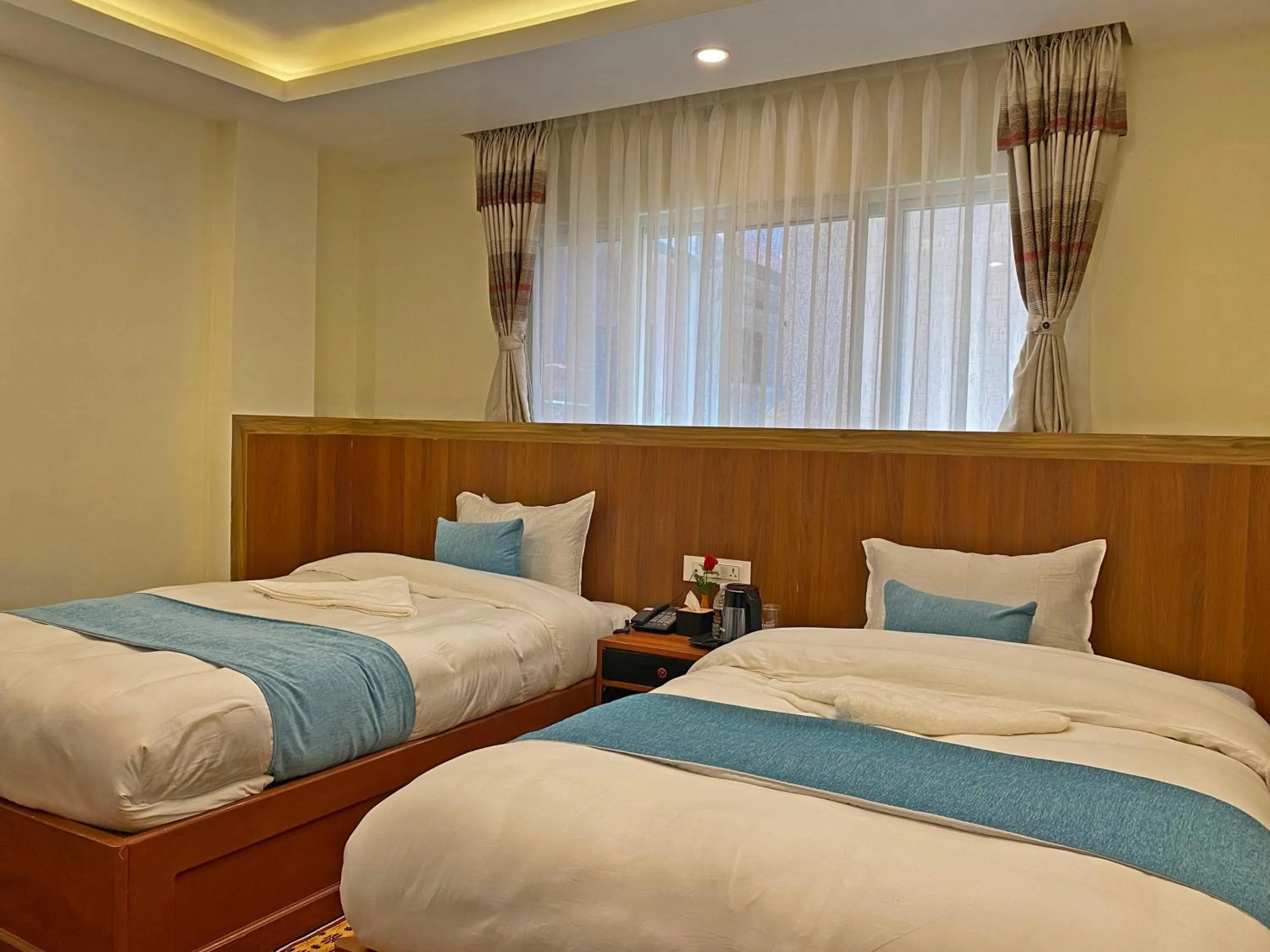 Bed in Hotel Himalayan BTS