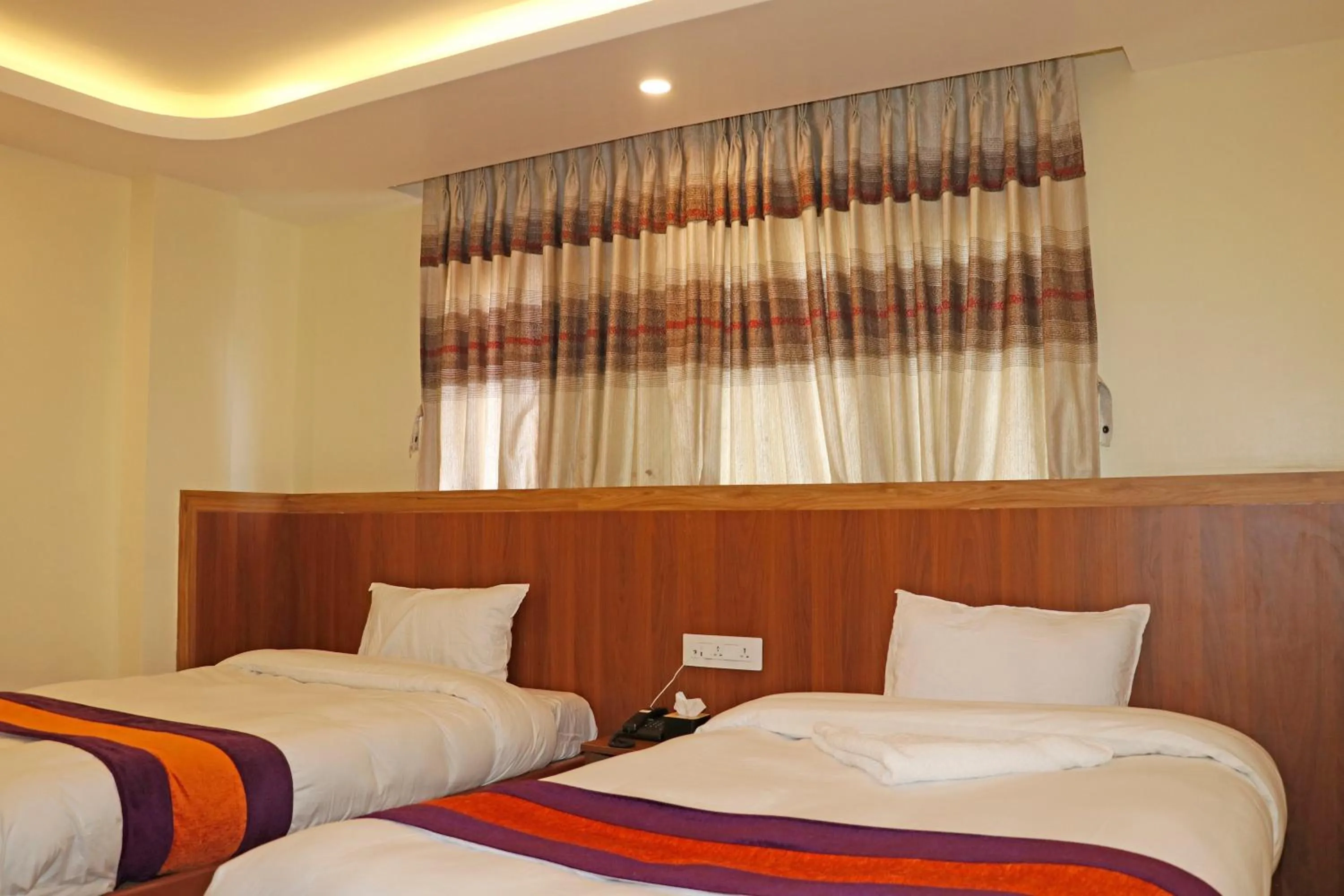Bed in Hotel Himalayan BTS