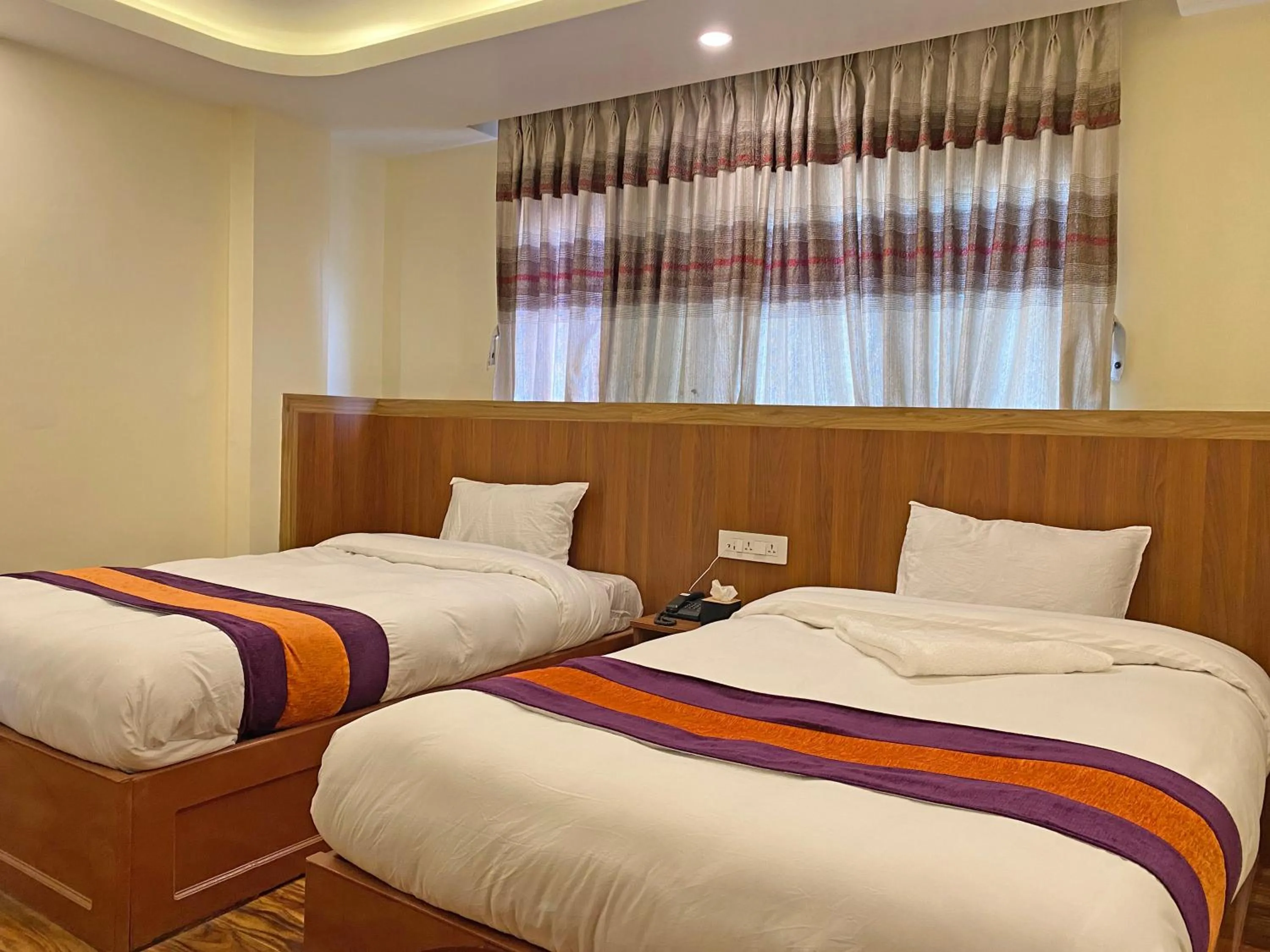 Bed in Hotel Himalayan BTS