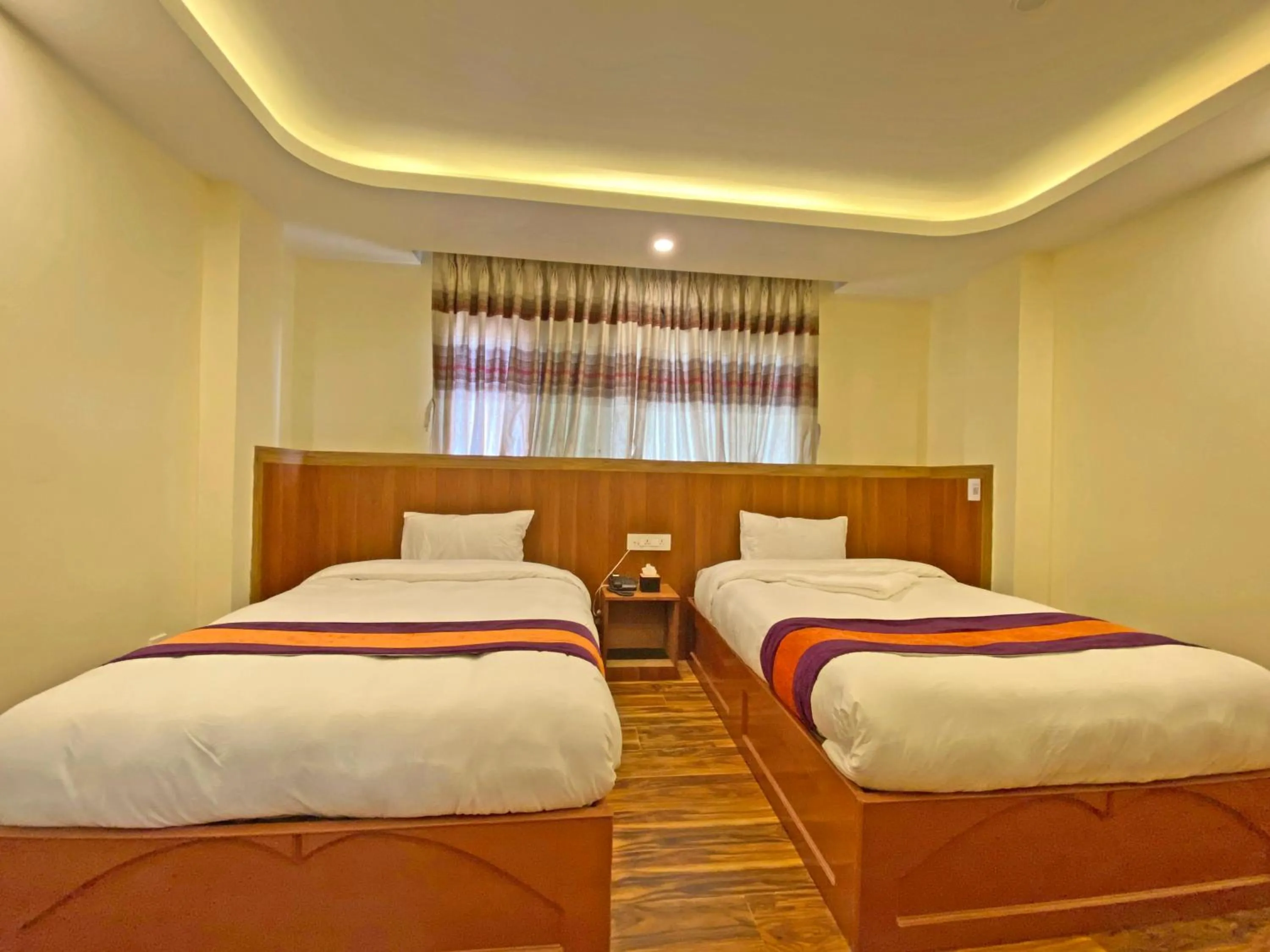 Bed in Hotel Himalayan BTS