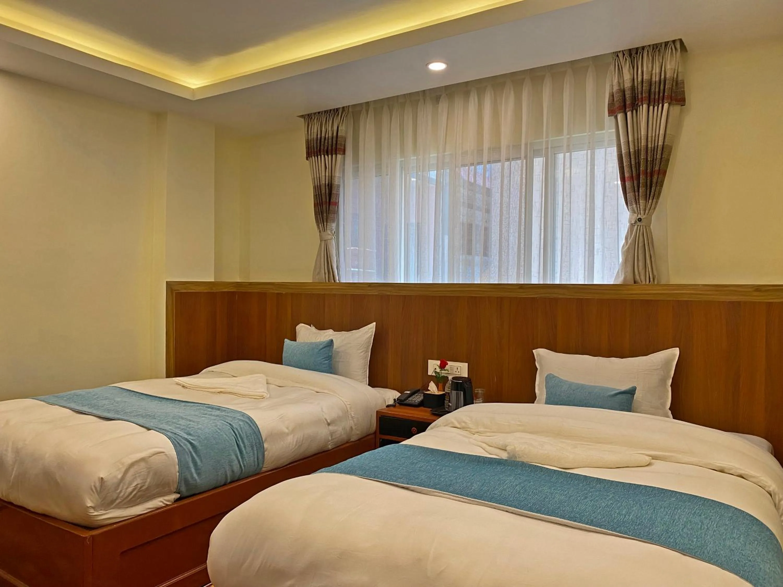 Bed in Hotel Himalayan BTS