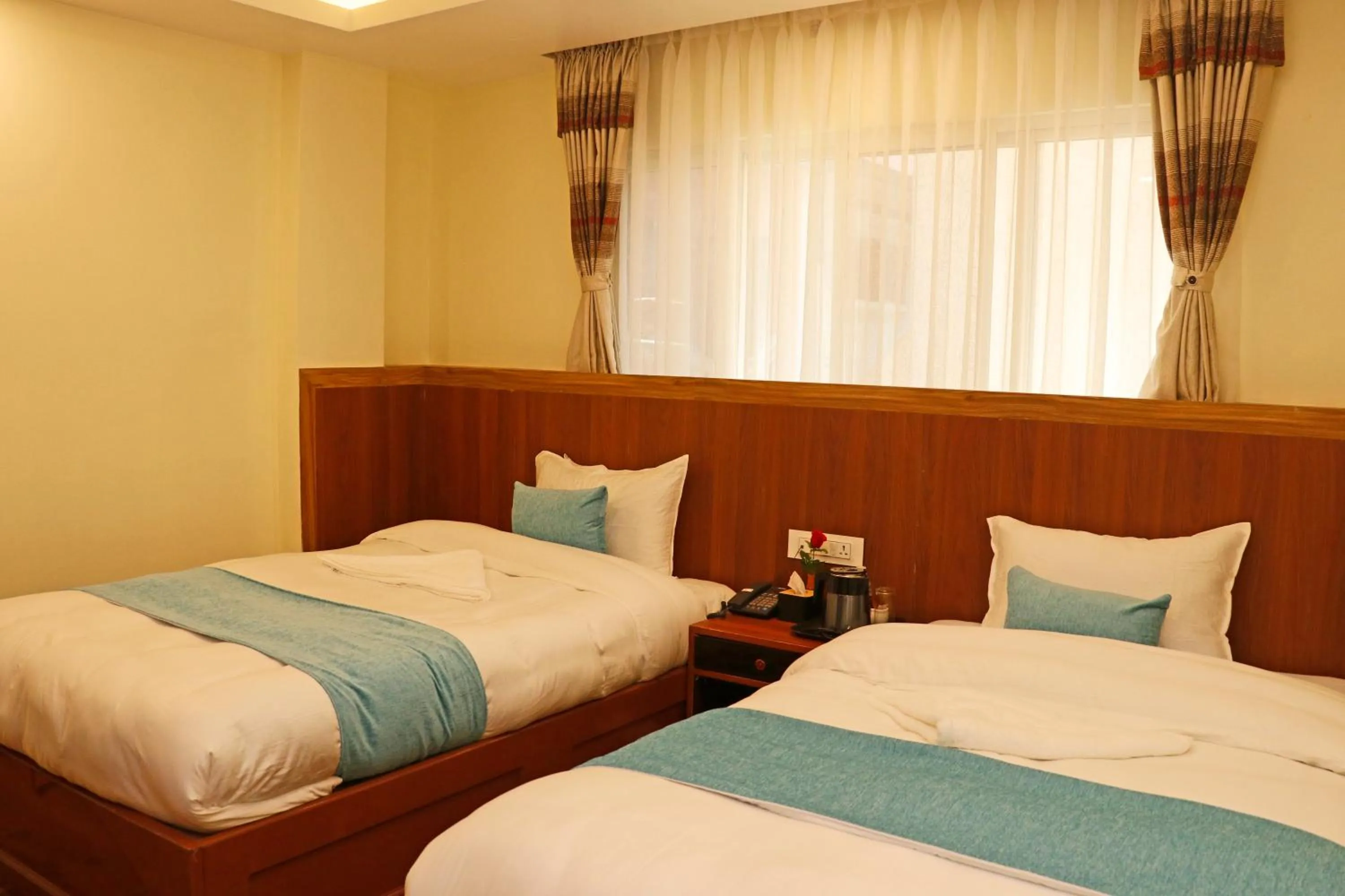 Bed in Hotel Himalayan BTS