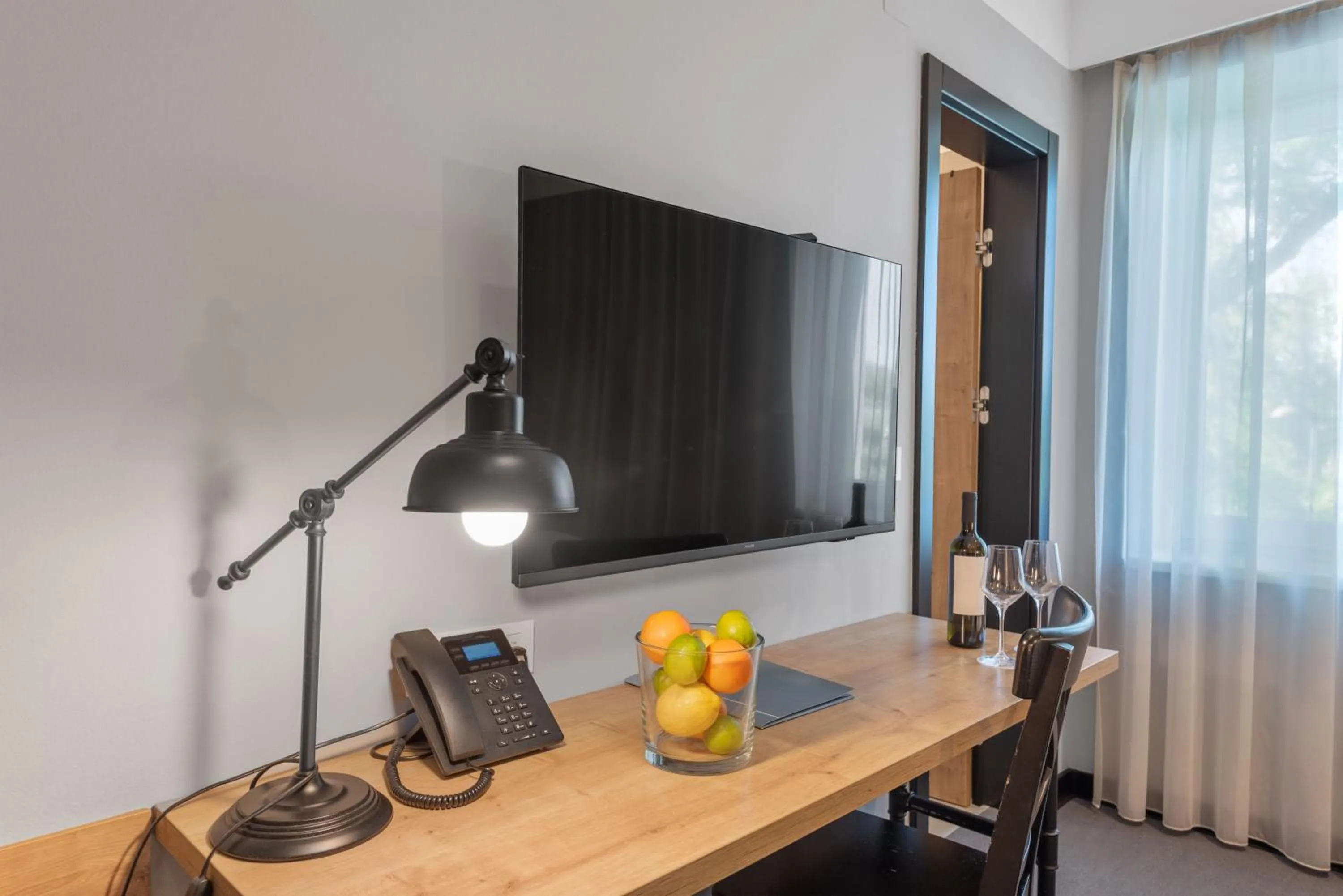 Communal lounge/ TV room in The Loop Hotel